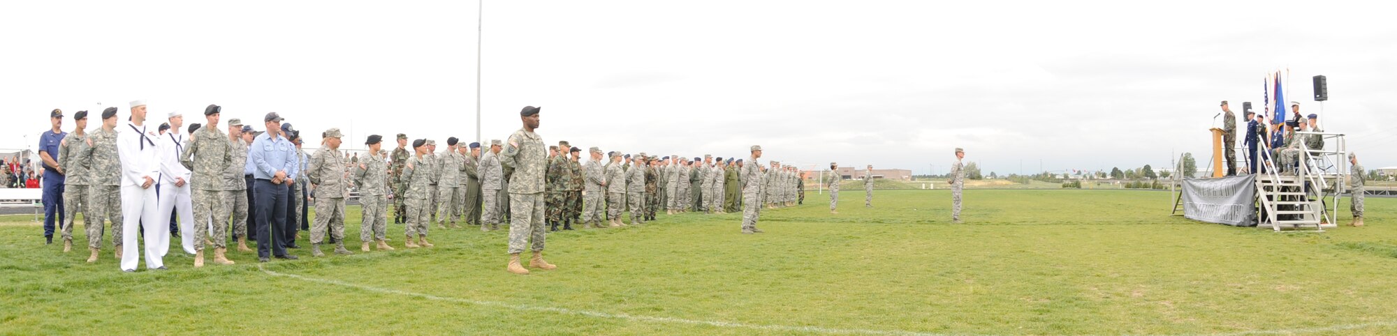 BUCKLEY AIR FORCE BASE, Colo. -- Members of Team Buckley stand in formation at the base running track, Sept. 11, as the base paid tribute to those who lost their lives on Sept. 11, 2001. (U.S. Air Force photo by Airman 1st Class Christopher Bush)