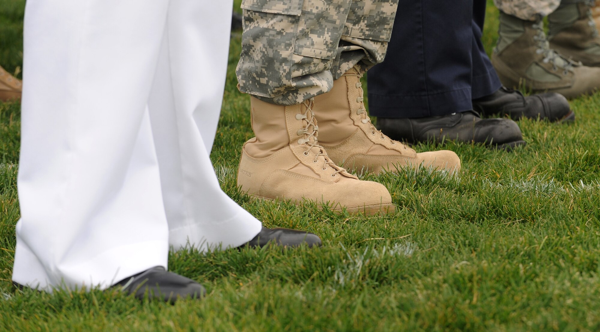 BUCKLEY AIR FORCE BASE, Colo. -- Members of Team Buckley stand in formation at the base running track, Sept. 11, as the base paid tribute to those who lost their lives on Sept. 11, 2001. (U.S. Air Force photo by Senior Airman Steven Czyz)