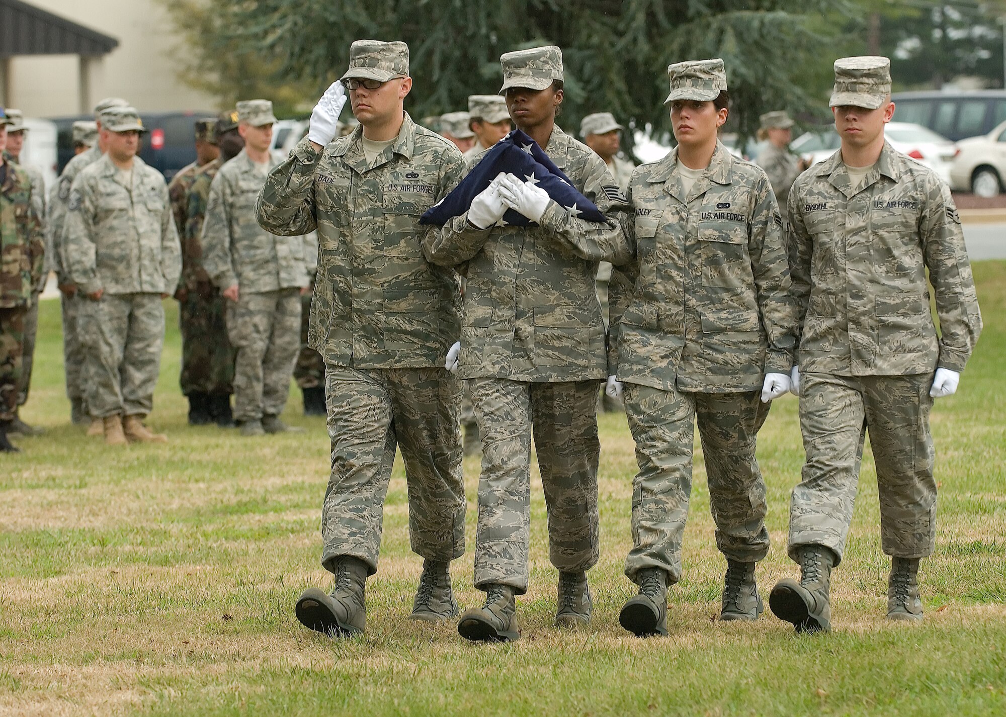 DOVER AIR FORCE BASE, Del. – (Left to right) Staff Sgt. Jeffrey Bade, Staff Sgt. Lennell DeLoatch, Airman 1st Class Nichole Dudley and Airman 1st Class Sven Engdahl, 436th Airlift Wing Honor Guard, carry the colors during a retreat ceremony Sept. 12 at the base flag pole. The ceremony concluded Dover’s annual POW/MIA Vigil where four Airmen stood a rotating watch at the base flag pole from 6:35 a.m. to 4 p.m. The Airmen faced the four cardinal directions in remembrance of servicemembers who are missing in action or were captured.  (U.S. Air Force photo/Jason Minto)
