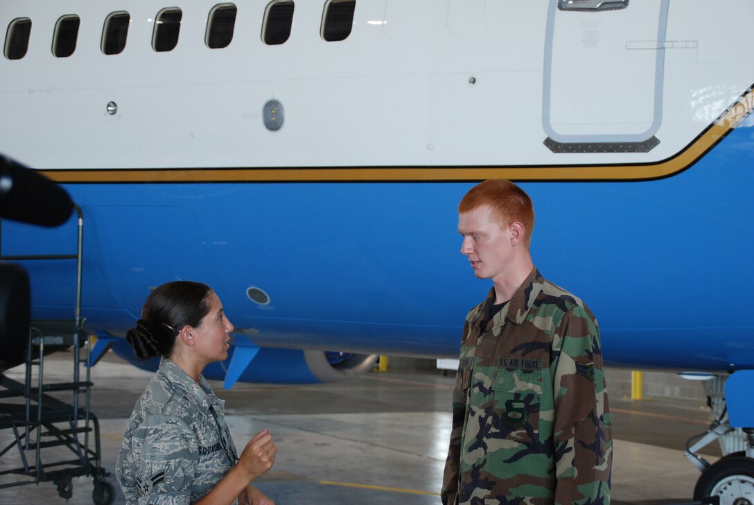 Airman First Class Jacob Schnauber, from the 932nd Airlift Wing Maintenance Group talks to representatives from the active duty and the Air Force Reserve Command's Illinois public affairs office during a documentary paying tribute to the work of the maintainers at the Air Force Reserve wing.   His work was captured for a new video.  U.S. photo by Maj. Stan Paregien