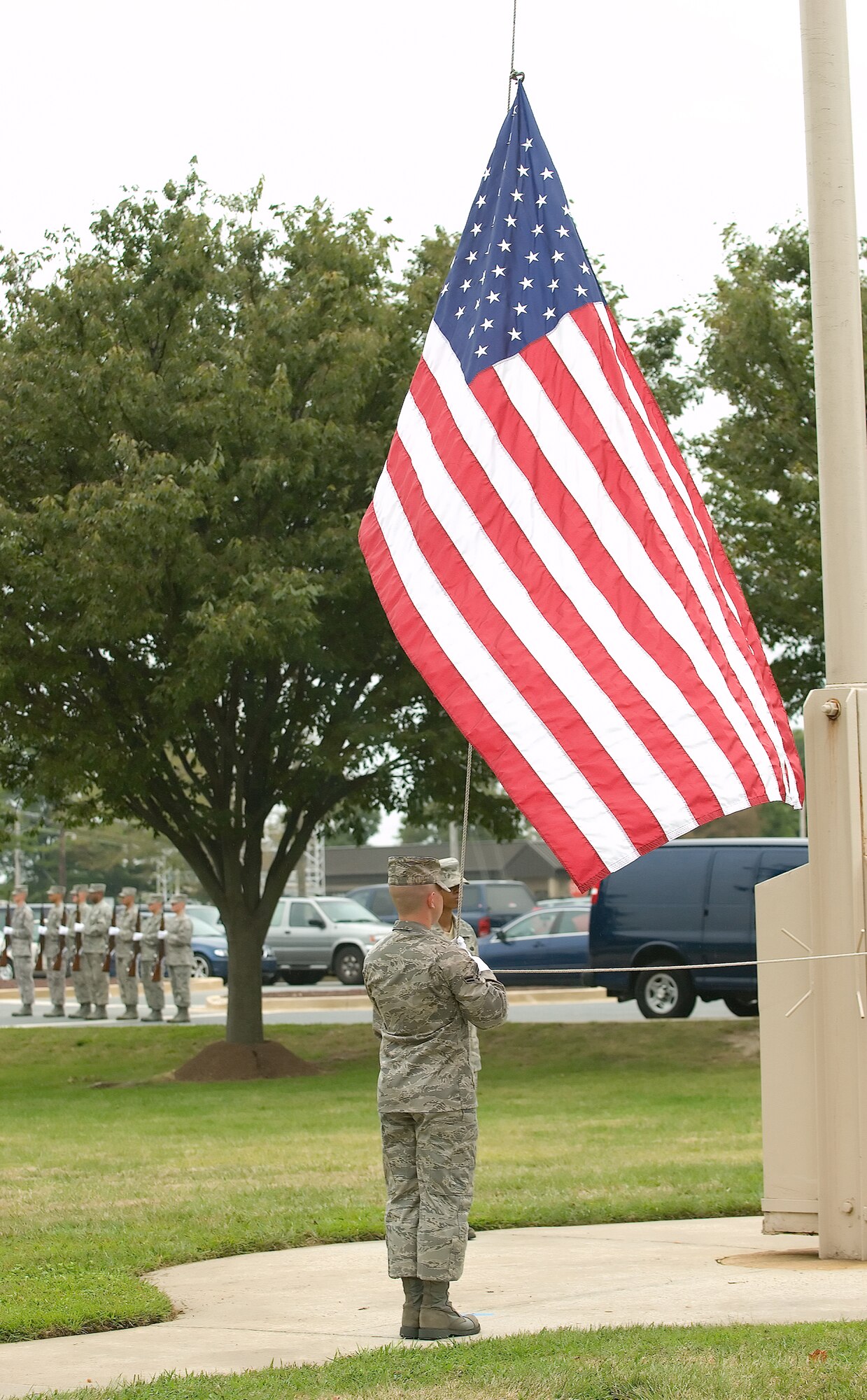 DOVER AIR FORCE BASE, Del. – Airman 1st Class Sven Engdahl, 436th Airlift Wing Honor Guard, lowers Old Glory during a retreat ceremony Sept. 12 at the base flag pole. The ceremony concluded Dover’s annual POW/MIA Vigil where four Airmen stood a rotating watch at the base flag pole from 6:35 a.m. to 4 p.m. The Airmen faced the four cardinal directions in remembrance of servicemembers who are missing in action or were captured.  (U.S. Air Force photo/Jason Minto)