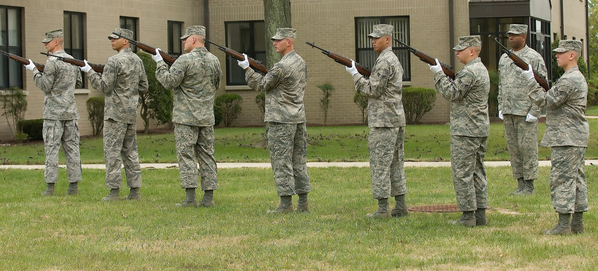 DOVER AIR FORCE BASE, Del. – Seven members of the 436th Airlift Wing Honor Guard perform a 21-gun salute during Dover’s annual POW/MIA Vigil Sept. 12 at the base flag pole. Four Airmen stood a rotating watch at the base flag pole from 6:35 a.m. to 4 p.m. The Airmen faced the four cardinal directions in remembrance of servicemembers who are missing in action or were captured.  (U.S. Air Force photo/Jason Minto)