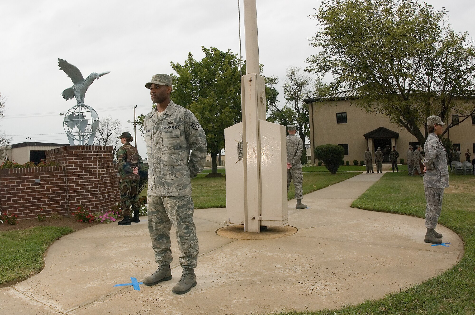 DOVER AIR FORCE BASE, Del. – Four Airmen stand facing the four cardinal directions during Dover’s annual POW/MIA Vigil Sept. 12 at the base flag pole. Four Airmen stood a rotating watch at the base flag pole from 6:35 a.m. to 4 p.m. The Airmen faced the four cardinal directions in remembrance of servicemembers who are missing in action or were captured. (U.S. Air Force photo/Jason Minto)