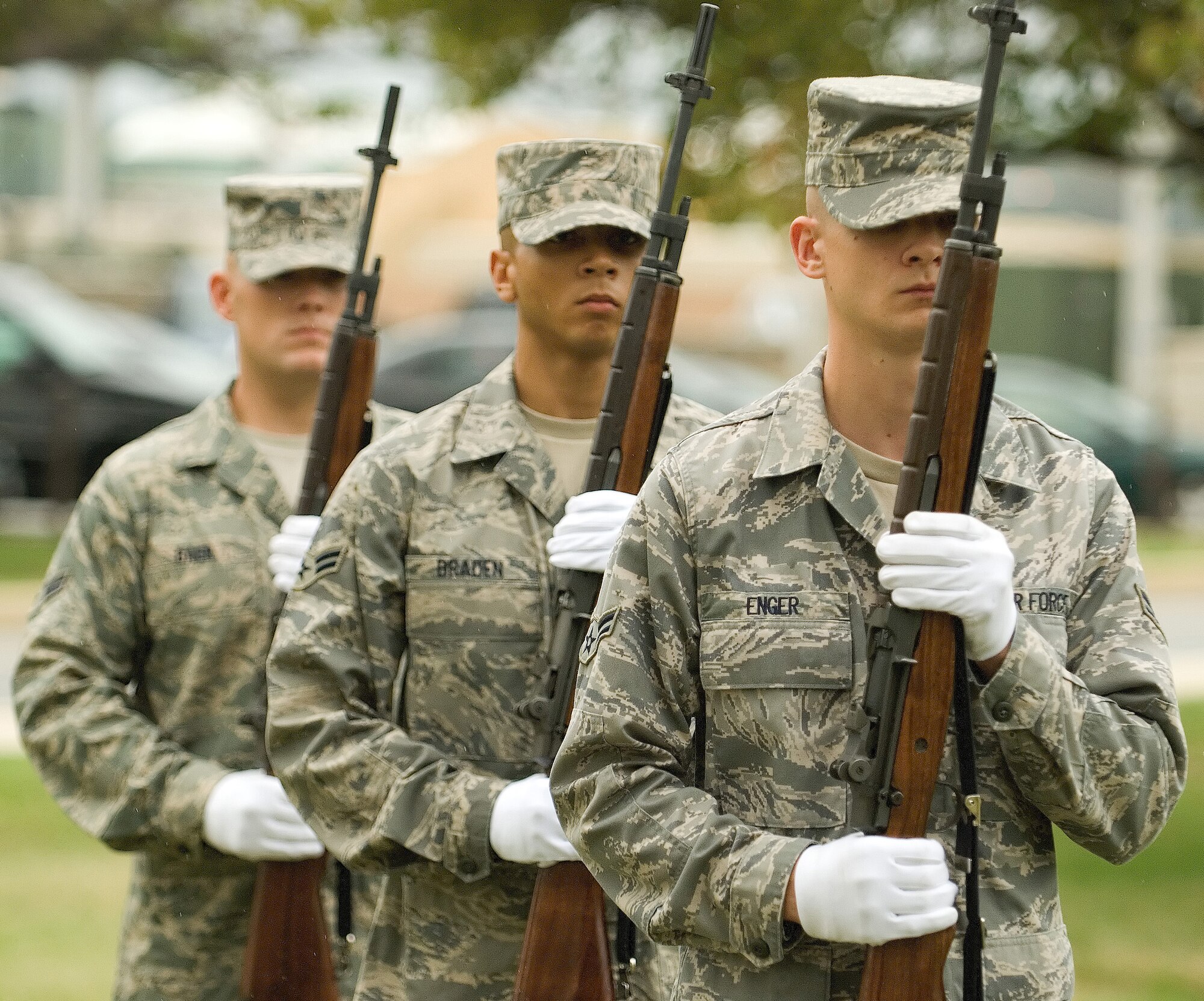 DOVER AIR FORCE BASE, Del. – Airmen 1st Class Matthew Enger, Deondra Braden and Haven Baer, 436th Airlift Wing Honor Guard, wait at port arms after performing a 21-gun salute Sept. 12 during Dover’s POW/MIA Vigil at the base flag pole. Four Airmen stood a rotating watch at the base flag pole from 6:35 a.m. to 4 p.m. The Airmen faced the four cardinal directions in remembrance of servicemembers who are missing in action or were captured. (U.S. Air Force photo/Roland Balik)