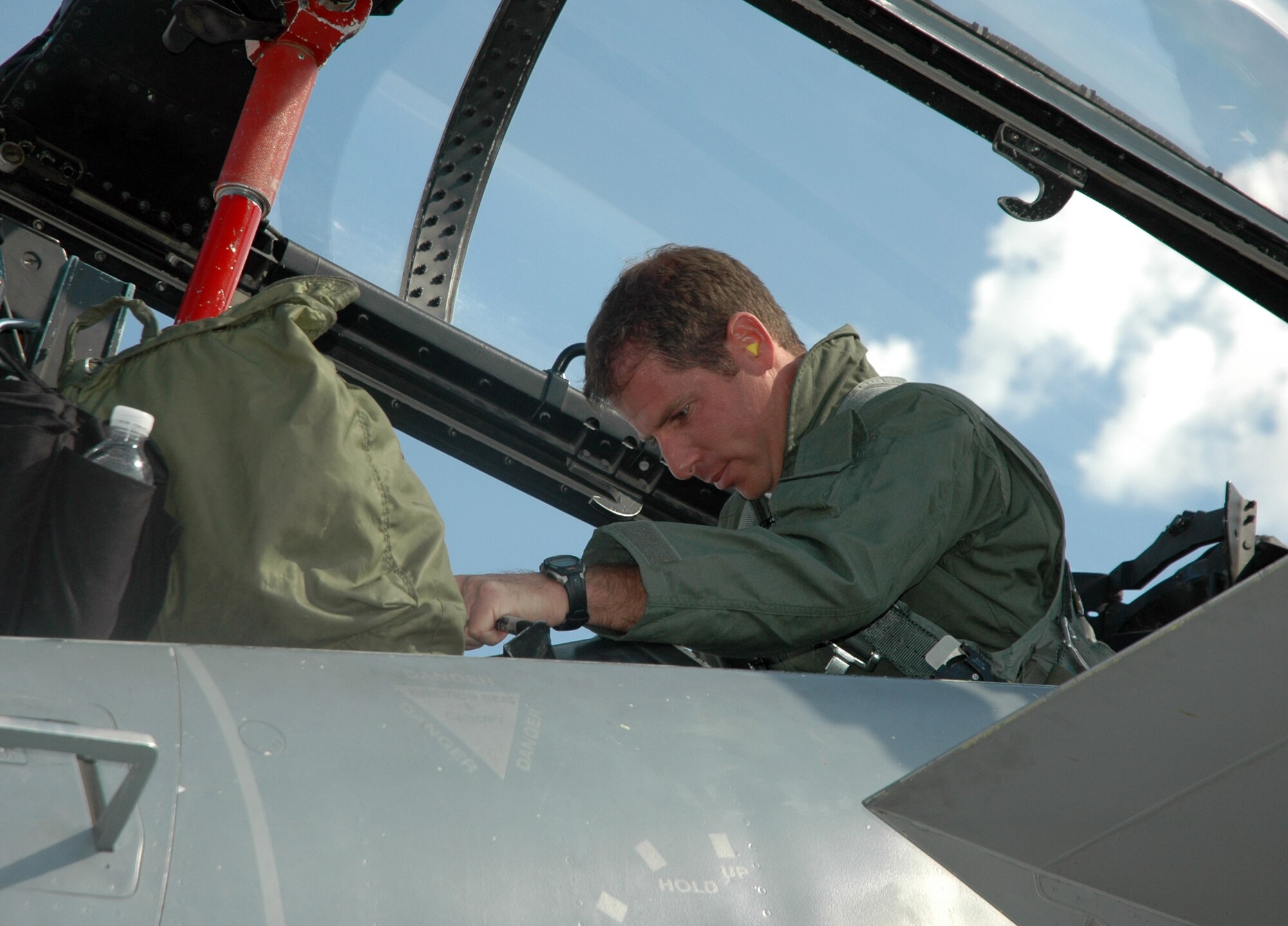 MOUNTAIN HOME AIR FORCE BASE, Idaho -- Brian Holmes, KBOI 670 news radio personality, straps in to an F-15D Eagle belonging to the 390th Fighter Squadron for his incentive flight Sept. 9. Base leadership used the incentive flights to strengthen ties between the base and local news outlets. (U.S. Air Force photo/ Staff Sgt. Rodney Ivey)