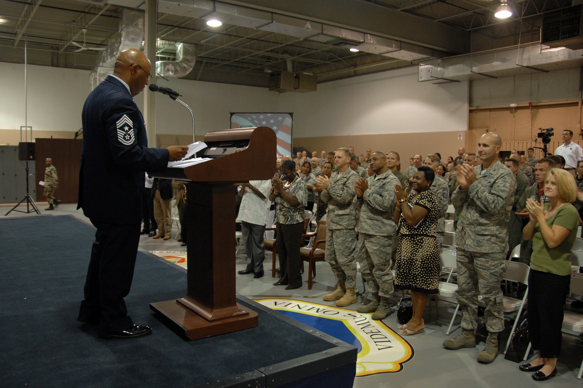 Chief Master Sgt. Kenneth Funderburg, 55th Wing command chief, retired Sept. 5 in a ceremony at Offutt’s Airman Leadership School. Chief Funderburg addresses a full house during his retirement speech.  Chief Funderburg played a critical role in improving the quality of life here with his efforts to build a new base exchange, mini-mall, child development center and Airman connection facility. (U.S. Air Force Photo By Josh Plueger)