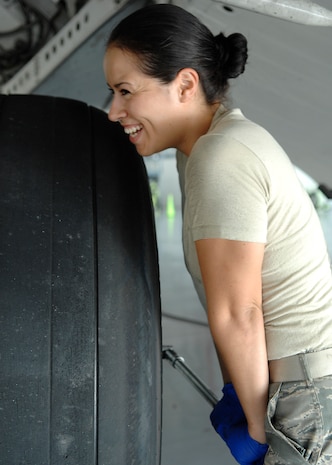 Senior Airman Marlene Roque breaks torque on a C-17 tire at the home station check hangar on Charleston AFB Sept. 15. Breaking torque loosens retaining bolts on the interior of the tire in order to remove it. Airman Roque is a crew chief with the 437th Maintenance Squadron. (U.S. Air Force photo/Airman 1st Class Katie Gieratz)