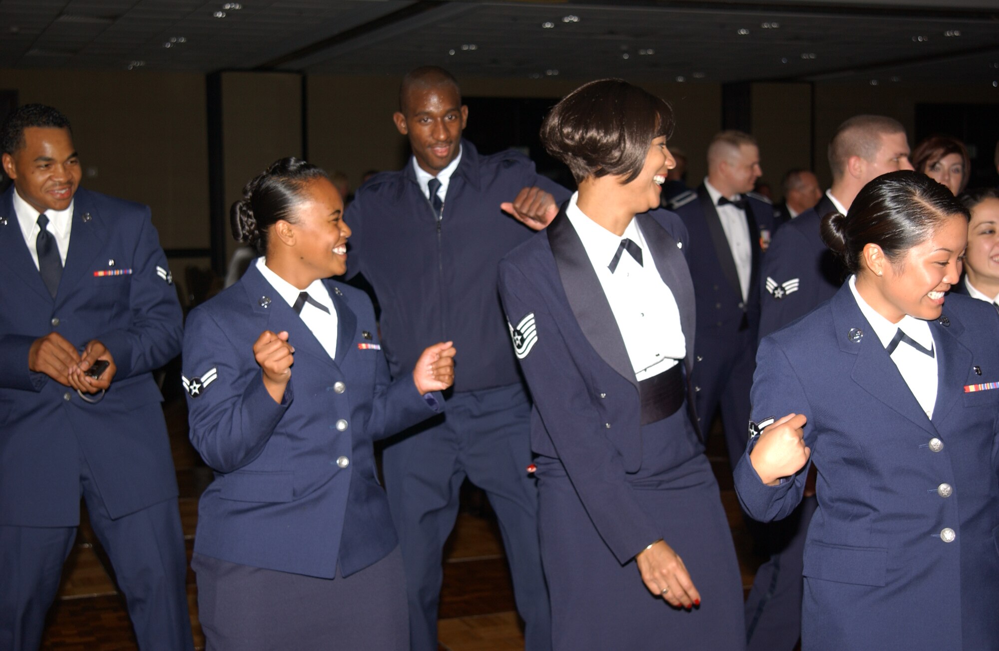 SCOTT AIR FORCE BASE, Ill. -- JTF Scott members dance the Cha Cha Silde at the 61st annual Air Force Ball. The ball, themed “Berlin Airlift” was held at the Hilton St. Louis at the Ballpark from 6-11 p.m. to celebrate the Air Force’s birthday. During the ball guest chose from a steak or chicken dinner, listened to a speech from key speaker, Lt. Gen. Rusty Findley, Air Mobility Command vice commander and finished the night with dancing. Attendees socialized with one another while remembering servicemembers who sacrificed their lives for freedom or were deployed. 
(US Air Force photo/Airman 1st Class Amber Kelly-Woodward)