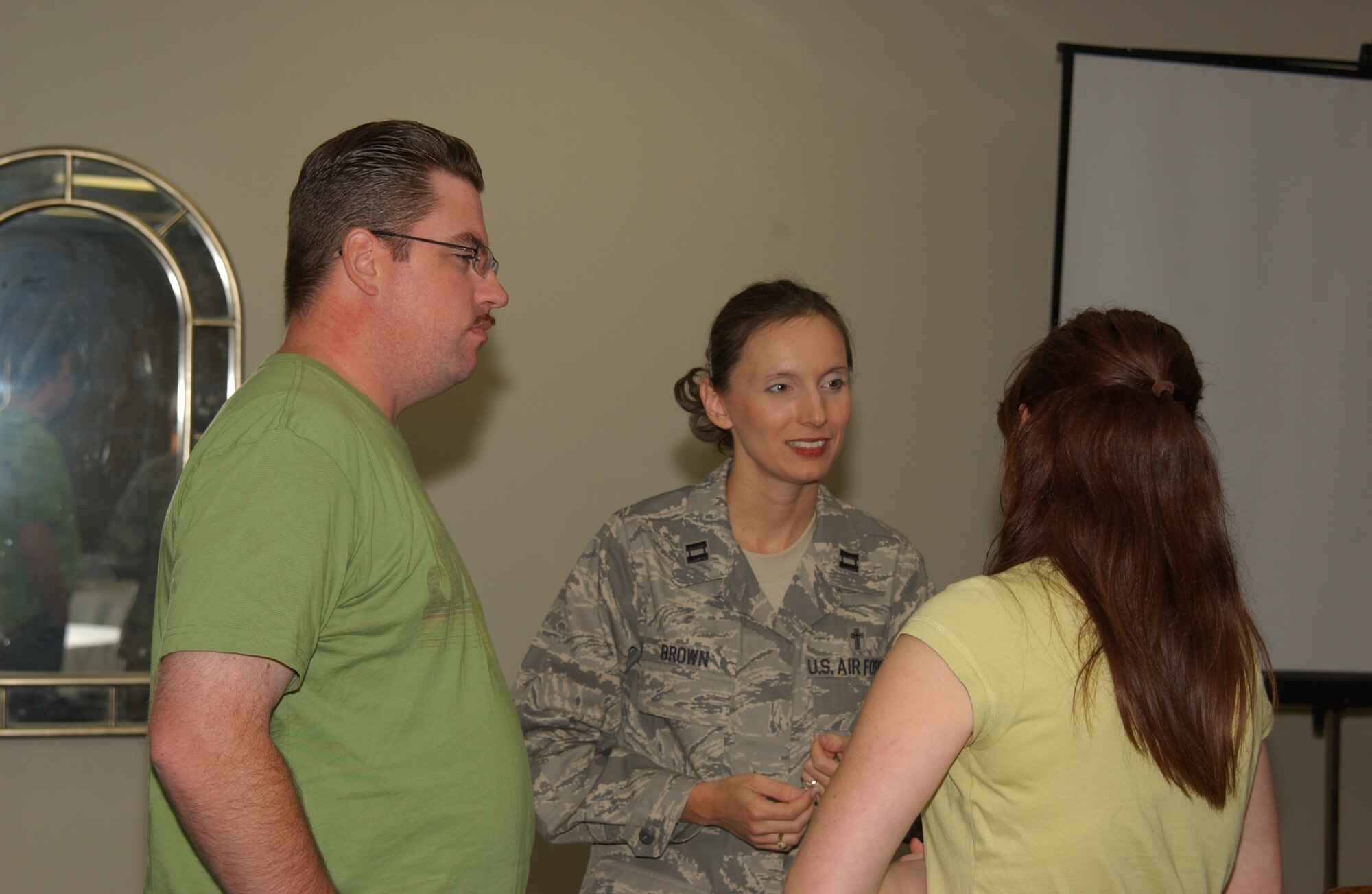 SCOTT AIR FORCE BASE, Ill. -- Staff Sgt. Troy Pryor, 618th Tanker Airlift Control Center air transportation craftsman, and his wife Nikki Pryor, Air Mobility Command headquarters air operations specialist, discuss building a strong marriage team with Ch. (Capt.) Nealy Brown, 375th Airlift Wing Reserve chaplain at the first session of the marriage enrichment program held Sept. 11 at the Our Lady of Snows Shrine in Belleville. 
(US Air Force photo/Airman 1st Class Amber Kelly-Woodward)