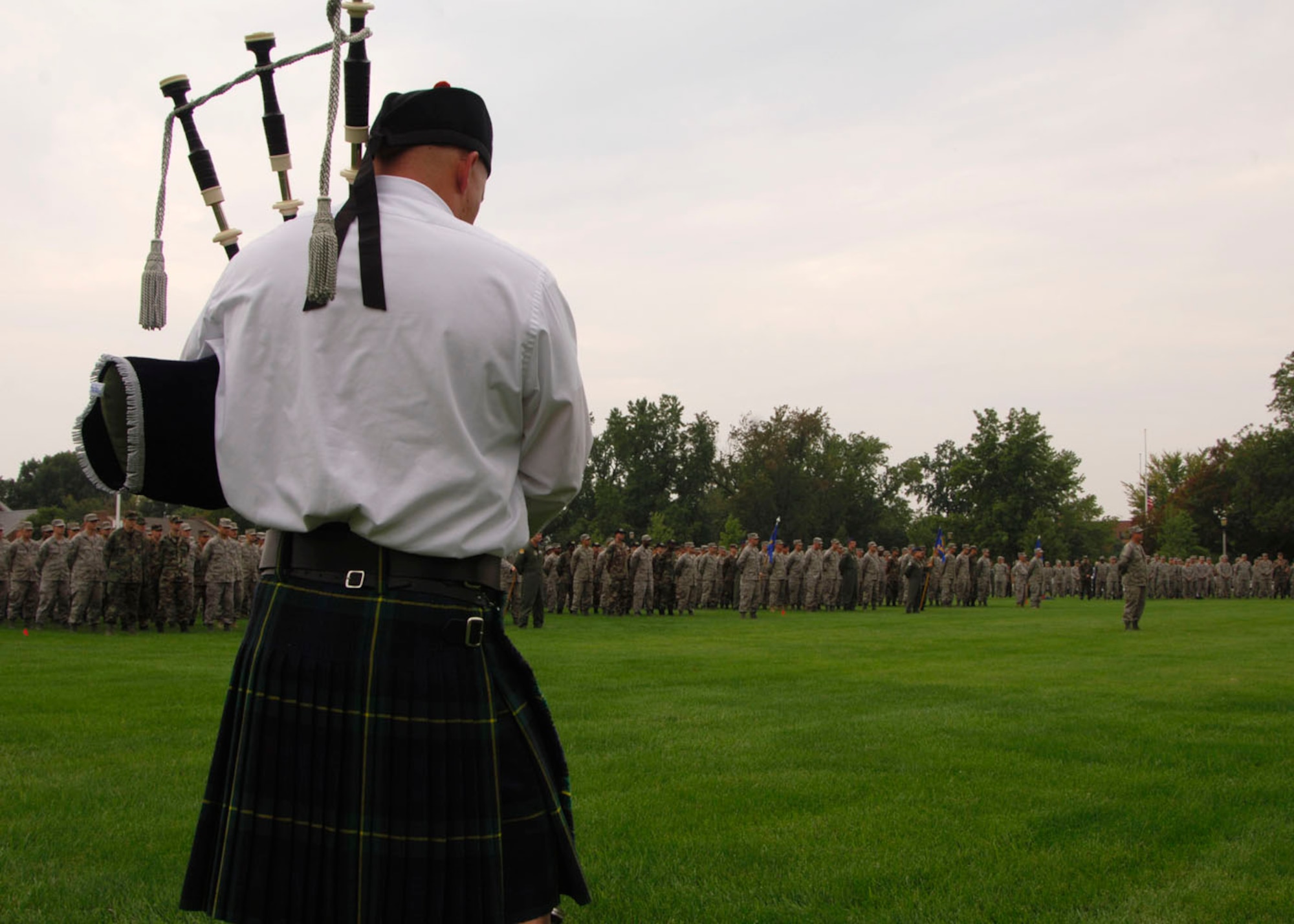 SCOTT AIR FORCE BASE, Ill. -- Tech. Sgt. John Cooper, 561st Network Operations Squadron, Detachment 5 NCOIC, plays the bag pipes during the Sept. 11 retreat. The retreat featured several members from JTF Scott in formation. The retreat included a prayer by Ch. (Capt.) Scott Savell, Air Mobility Command command chaplain intern, a flyover and folding of the flag by the base honor guard.  
(US Air Force photo/Airman 1st Class Wesley Farnsworth)