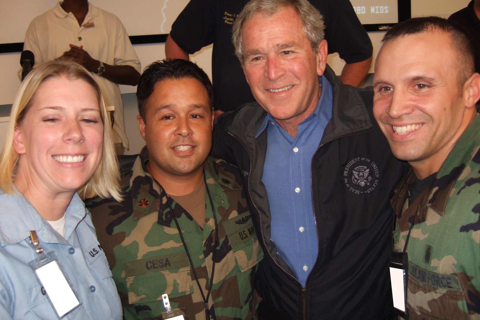 U.S. Navy Petty Officer 2nd Class Beverly Glauber, U.S. Navy Lt. Cmdr. Christopher Cesa and Tech. Sgt. Ralph Onesko, all with the Global Patient Movement Requirements Center, pose for a photo with President George Bush in the Louisiana Emergency Operations Center Sept. 3. President Bush visited to personally thank those who responded to support the residents and areas affected by Hurricane Gustav.
(Courtesy photo)
