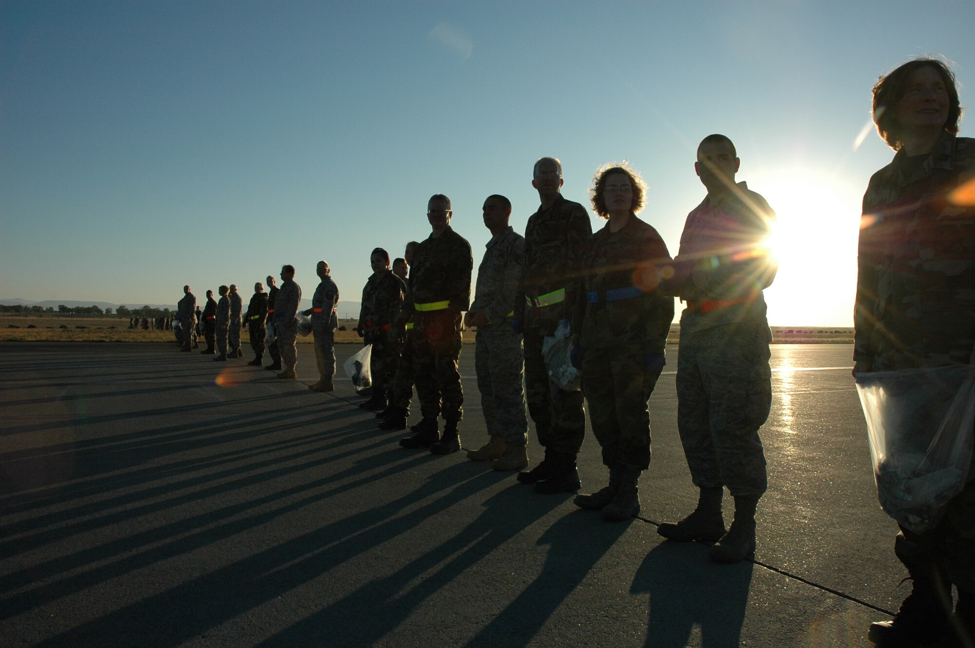 MOUNTAIN HOME AIR FORCE BASE, Idaho - Gunfighters prepare to start the foreign object debris walk to pick up trash along the flightline of Mountain Home Air Force Base Sept. 15. The FOD walk was scheduled to clear the flightline of objects that were left over after the Gunfighter Skies 2008 air show held over the weekend. (U.S. Air Force photo\ Staff Sgt. Rodney Ivey)