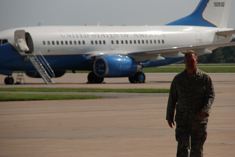 Lt. Col. Kirk Peddicord takes his final walk to the hangar at the 932nd Airlift Wing before moving to Texas.  Behind him is the C-40C distinguished visitor aircraft belonging to the Air Force Reserve Command.  (U.S. Air Force photo by Maj. Stan Paregien)