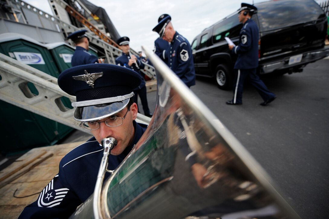Tubist Master Sgt. Brian Sands warms up before performing with The U.S. Air Force Band at the Pentagon Memorial Dedication Ceremony on Sept. 11, 2008. Under the direction of Col. Dennis M. Layendecker, The U.S. Air Force Concert Band and Singing Sergeants provided a moving musical tribute to those who lost their lives at the Pentagon on Sept. 11, 2001. The memorial site contains 184 inscribed memorial units honoring the 59 people aboard American Airlines Flight 77 and the 125 in the building who lost their lives that day.(DoD photo by D. Myles Cullen, U.S. Army/Released)