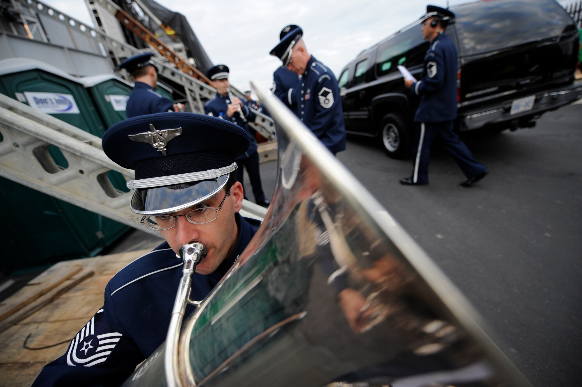 Tubist Master Sgt. Brian Sands warms up before performing with The U.S. Air Force Band at the Pentagon Memorial Dedication Ceremony on Sept. 11, 2008. Under the direction of Col. Dennis M. Layendecker, The U.S. Air Force Concert Band and Singing Sergeants provided a moving musical tribute to those who lost their lives at the Pentagon on Sept. 11, 2001. The memorial site contains 184 inscribed memorial units honoring the 59 people aboard American Airlines Flight 77 and the 125 in the building who lost their lives that day.(DoD photo by D. Myles Cullen, U.S. Army/Released)