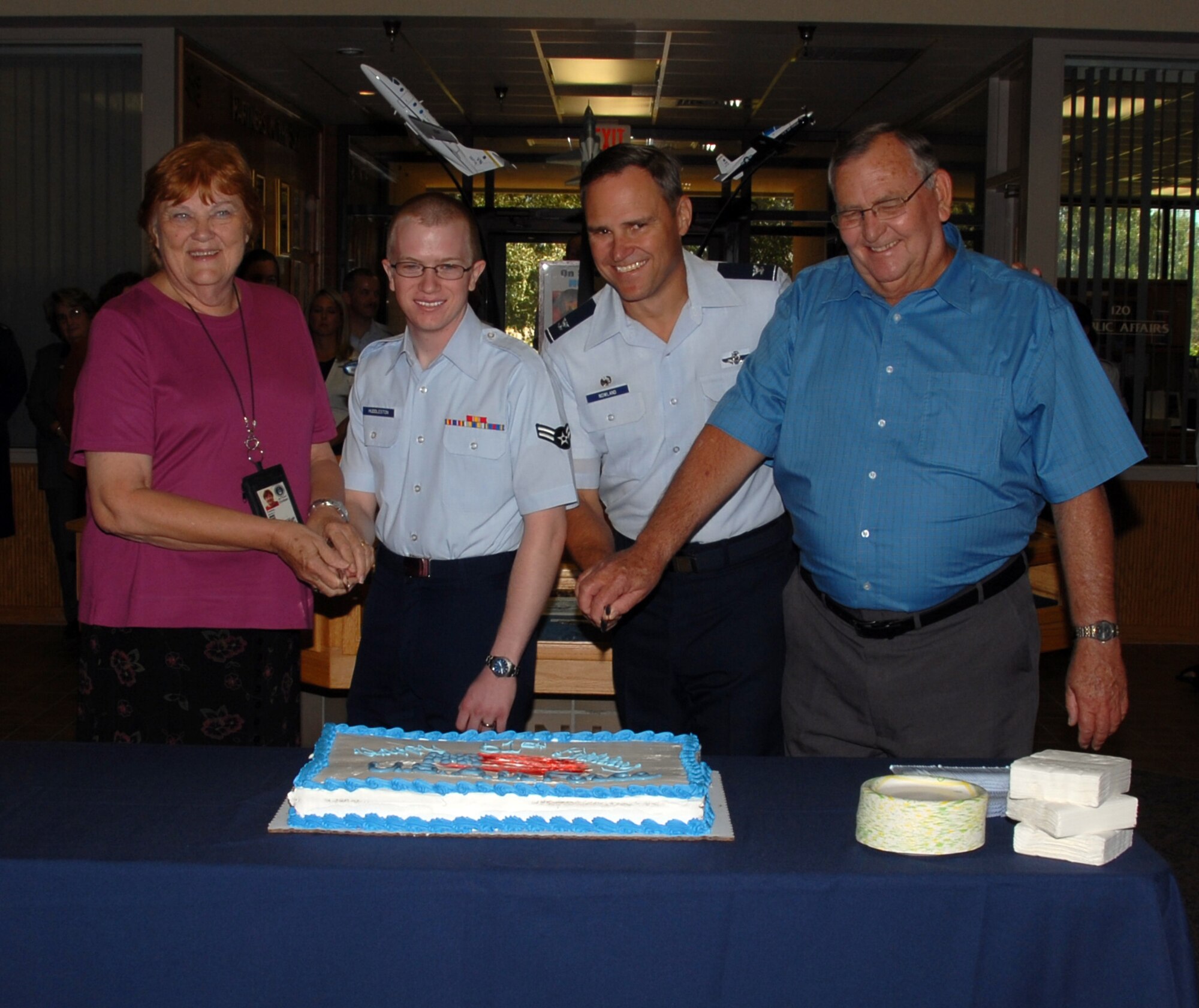 Team Vance recognized the Air Force birthday with an early cake cutting Sept. 15, by, left to right, Jean Forshee, Airman 1st Class Trevor Huddleston, Col. Mark Nowland and Warren Scheffe. Ms. Forshee is the senior government employee at Vance AFB, Okla., serving here since 1977. Airman Huddleston, 18 years old, is the junior enlisted Airman at Vance. Colonel Nowland is the 71st Flying Training Wing commander. Mr. Scheffe is the senior contract employee at Vance, working here since 1960. During the ceremony in the atrium of the 71st FTW headquarters building, Colonel Nowland pointed out that, “Twenty years from now, on the 81st Air Force birthday, who knows what kind of aircraft lieutenants at this ceremony will be flying.” The Air Force keeps moving higher and meeting new challenges, he said. (U.S. Air Force photo by Angie Roche)