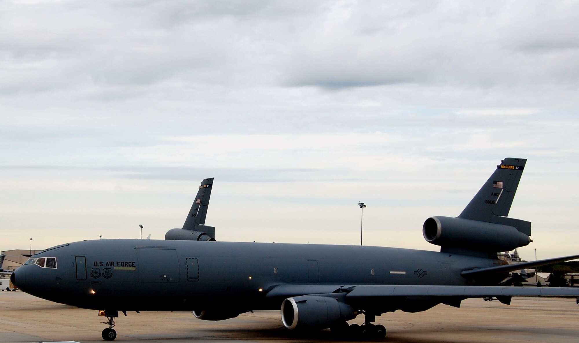A KC-10 Extender taxis off the parking ramp en route to taking off for a mission from McGuire Air Force Base, N.J., Sept. 16, 2008.  The KC-10 is one of the main aircraft types stationed at McGuire which helps Air Mobility Command and the Air Force to "fly, fight and win...in air, space and cyberspace."  (U.S. Air Force Photo/Tech. Sgt. Scott T. Sturkol)