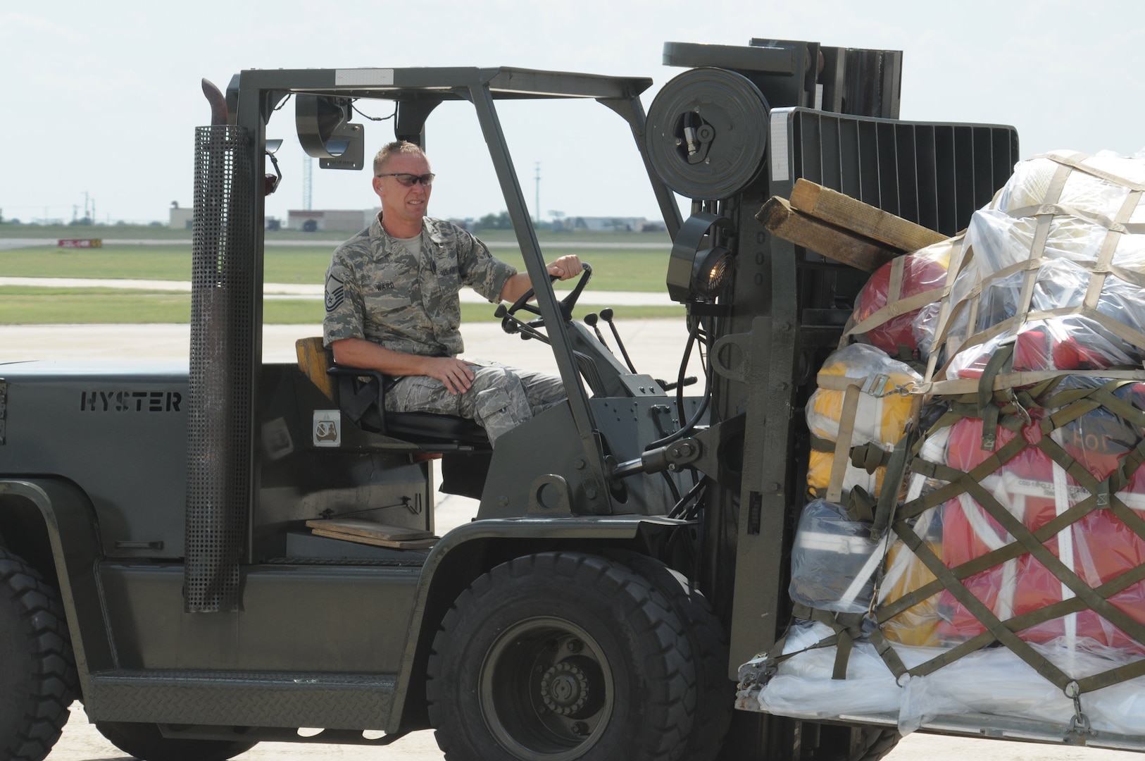 An Airman prepares to load a C-130 on the Randolph flightline Sept. 13. Airmen from across the United States prepared for search and rescue missions last week as Hurricane Ike approached the Texas coastline. (U.S. Air Force photo by Steve White)