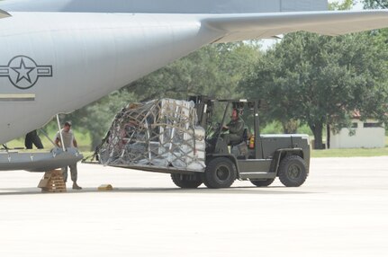 An Airman loads a C-130 on the Randolph flightline Sept. 13. Airmen from across the United States prepared for search and rescue missions last week as Hurricane Ike approached the Texas coastline. (U.S. Air Force photo by Steve White)