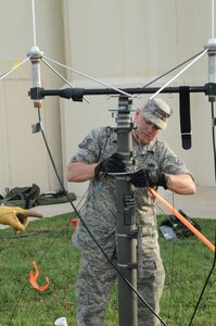 An Airman sets up transmission equipment to ensure it is in proper working condition prior to deploying in support of hurricane relief efforts. Airmen from across the United States prepared for search and rescue missions last week as Hurricane Ike approached the Texas coastline. (U.S. Air Force photo by Steve White)