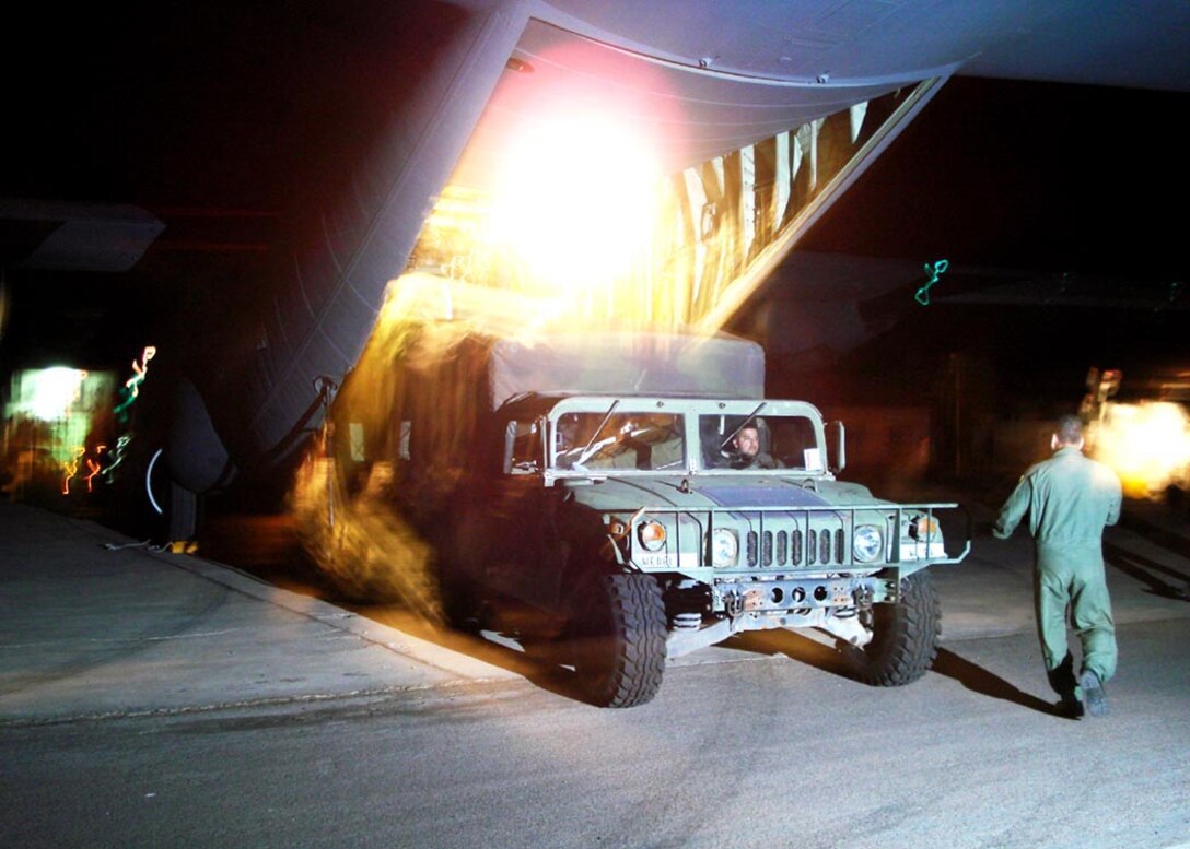 A USAF Hummer filled with medical supplies, assigned to Joint Task Force Bravo, Soto Cano Air Base, Republic of Honduras, exits a Maryland National Guard C-130J during earthquake relief efforts in Pisco, Peru Aug. 2007. Efforts like these are an example of the relief that will be jointly provided by the 18 countries that comprise SICOFAA.  (USAF photo by Col. William A. Stark)