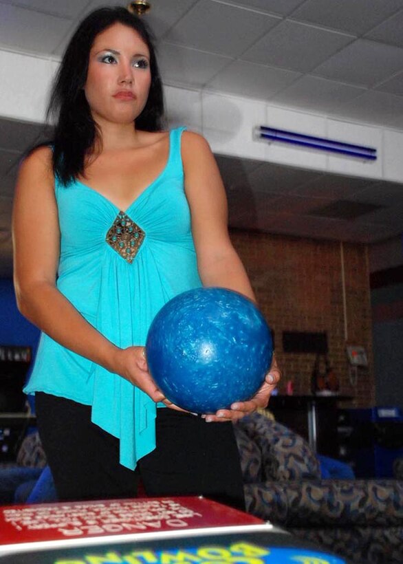 Senior Airman Kristin M. Cavander, 316th Security Forces Squadron entry controller, prepares to take her turn during Cosmic Bowling at the Bowling Center Sept. 13. (USAF photo by Airman Katie L. Justen)