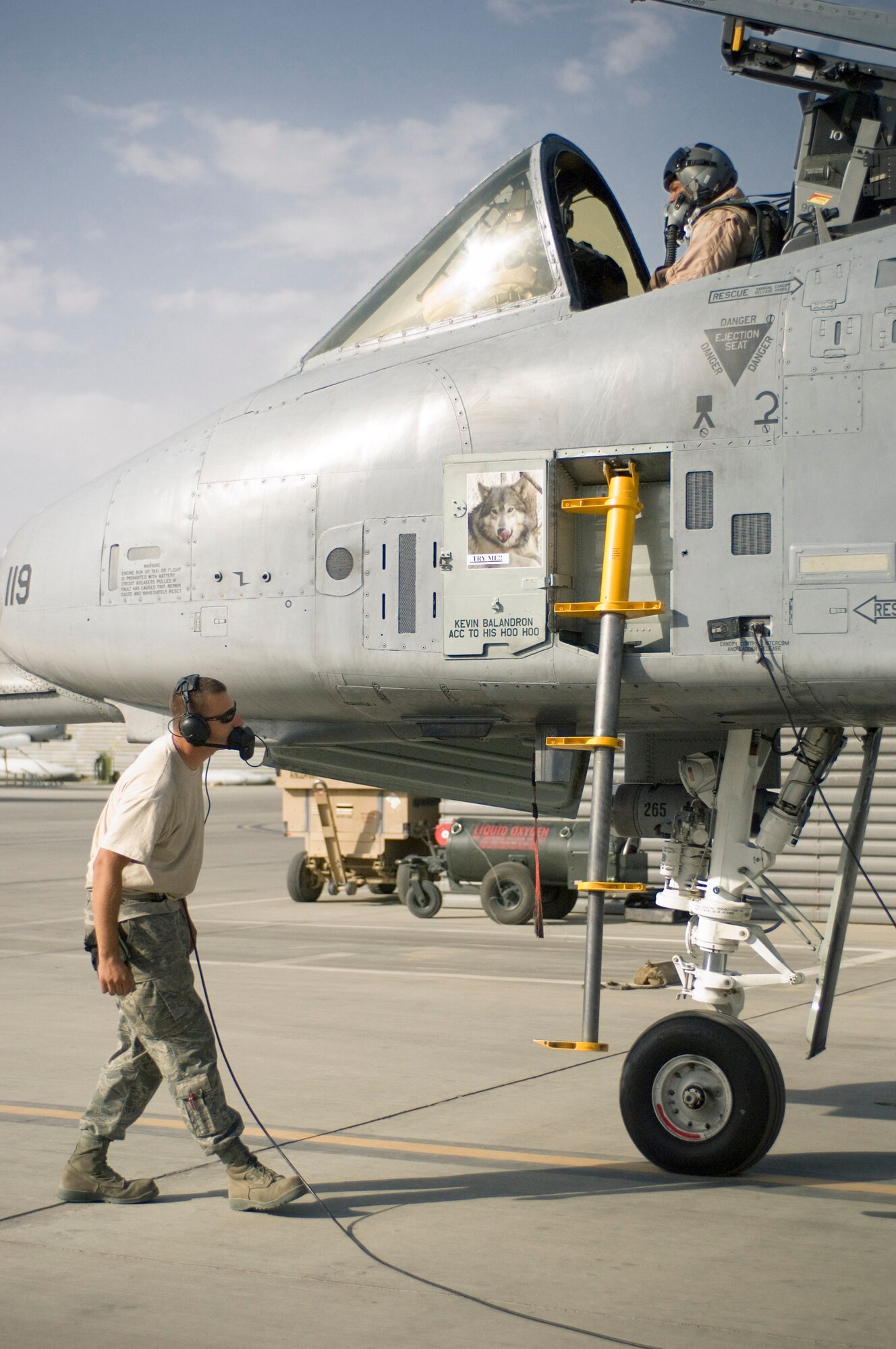 Staff Sgt. Kevin Bliem, a crew chief with the 455th Expeditionary Aircraft Maintenance Squadron, and Lt. Col. Thomas Fennell, a pilot with the 103rd Expeditionary Fighter Squadron, perform final pre-flight checks prior to a close air support mission at Bagram Air Field, Afghanistan, Sept. 12. Sergeant Bliem and Colonel Fennell are both Pennsylvania Air National Guardsmen deployed from the 111th Fighter Wing. (U.S. Air Force photo by Staff Sgt. Rachel Martinez/Released)