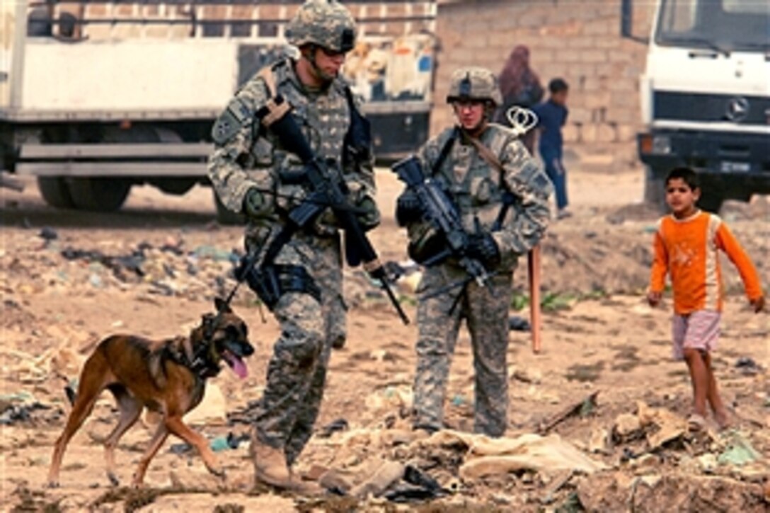 U.S. soldiers assigned to the 3rd Infantry Division's Company B, 4th Battalion, 64th Armor Regiment, 4th Brigade Combat Team, conduct a patrol in Baghdad, Iraq, Sept. 15, 2008.