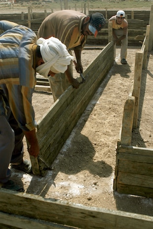 FALLUJAH, Iraq (Sept. 17, 2008) – Local Iraqis begin building the future home of a girls secondary school in a rural area of southwest Fallujah, Sept. 17. Civil Affairs Team 3, 2nd Battalion, 11th Marines, in direct support of Task Force 3rd Battalion, 6th Marines, Regimental Combat Team 1, is overseeing the two-story, 12-classroom school. Local tribal leaders and Iraq’s Ministry of Education are providing the staff and school supplies when the project is complete. (Official U.S. Marine Corps photo by Cpl. Chris Lyttle) (RELEASED)