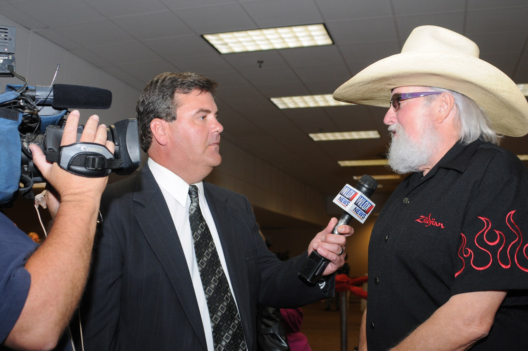 Reporter Don Culpepper, WLOX TV-13 (ABC), interviews Charlie Daniels about the the opportunity to meet Keesler Air Force Base leadership as well as several Airmen who earned Bronze Stars for their actions in Iraq.  Shortly after the reception the Charlie Daniels Band then performed for an audience of Airmen, families and community members who traveled to Keesler.  The concert was part of the Air Force 's 61st birthday celebration.  (U.S. Air Force photo by Kemberly Groue)