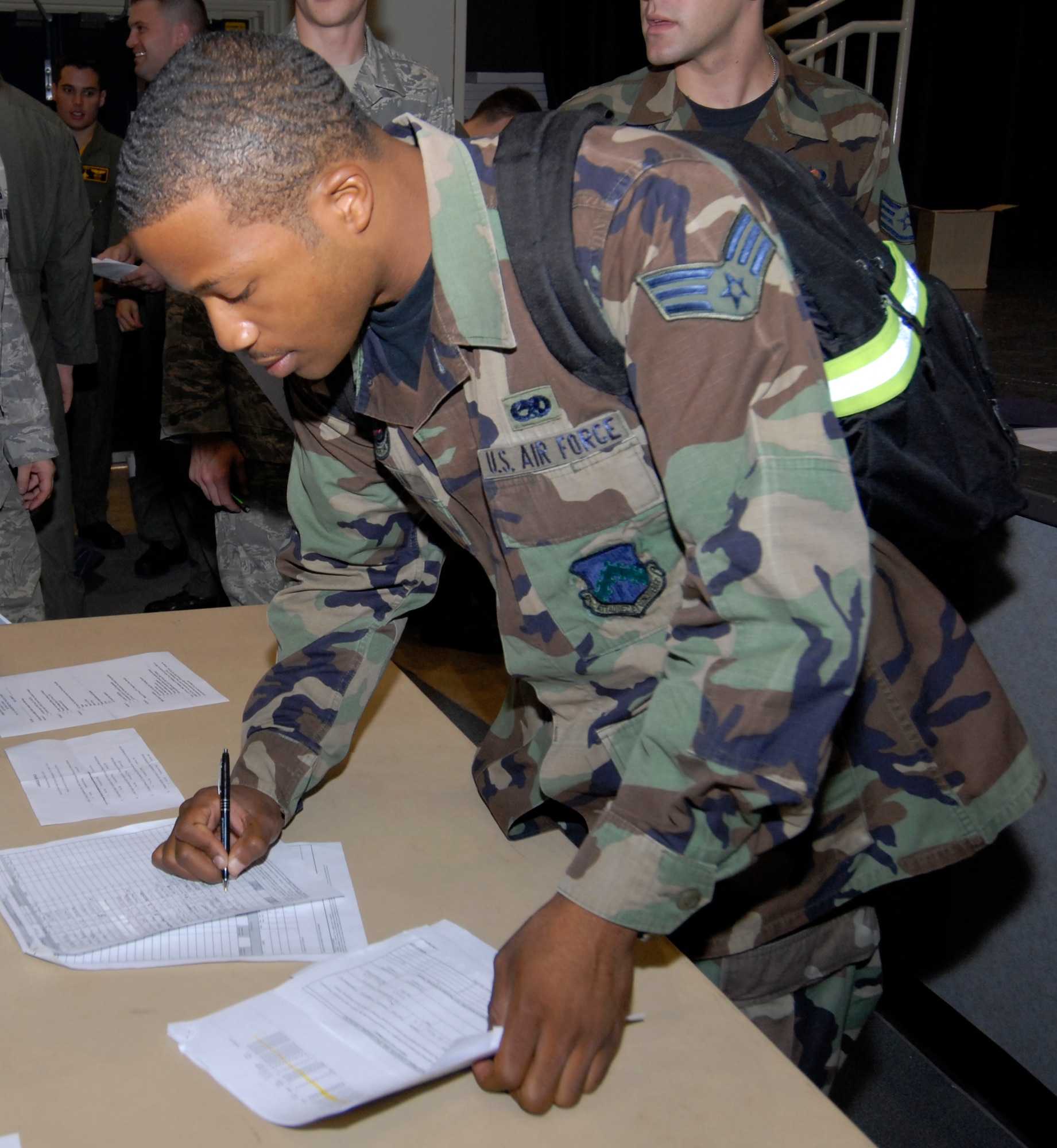 KUNSAN AIR BASE, Republic of Korea -Senior Airman Ronnie Lyman, 8th Maintenance Squadron completes paperwork in the Personnel Deployment Function line before forward deploying in support of exercise Red Flag-Alaska here Sept. 12. The PDF Line is the final check for deploying Airman to ensure all paper work is correct and shot records are up to date before deploying. (U.S. Air Force photo by Senior Airman Dana Hill)