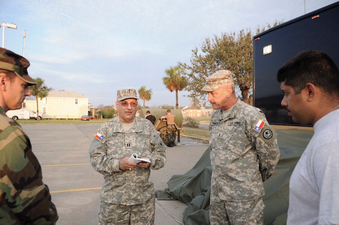 Texas State Guard Chaplain Fair holds a prayer meeting for the Soldiers and Airmen of the Texas Military Forces on Galveston Island to pray for the families who lost everything due to Hurricane Ike. September 18, 2008 (Air Force photo by SMSgt Elizabeth Gilbert)