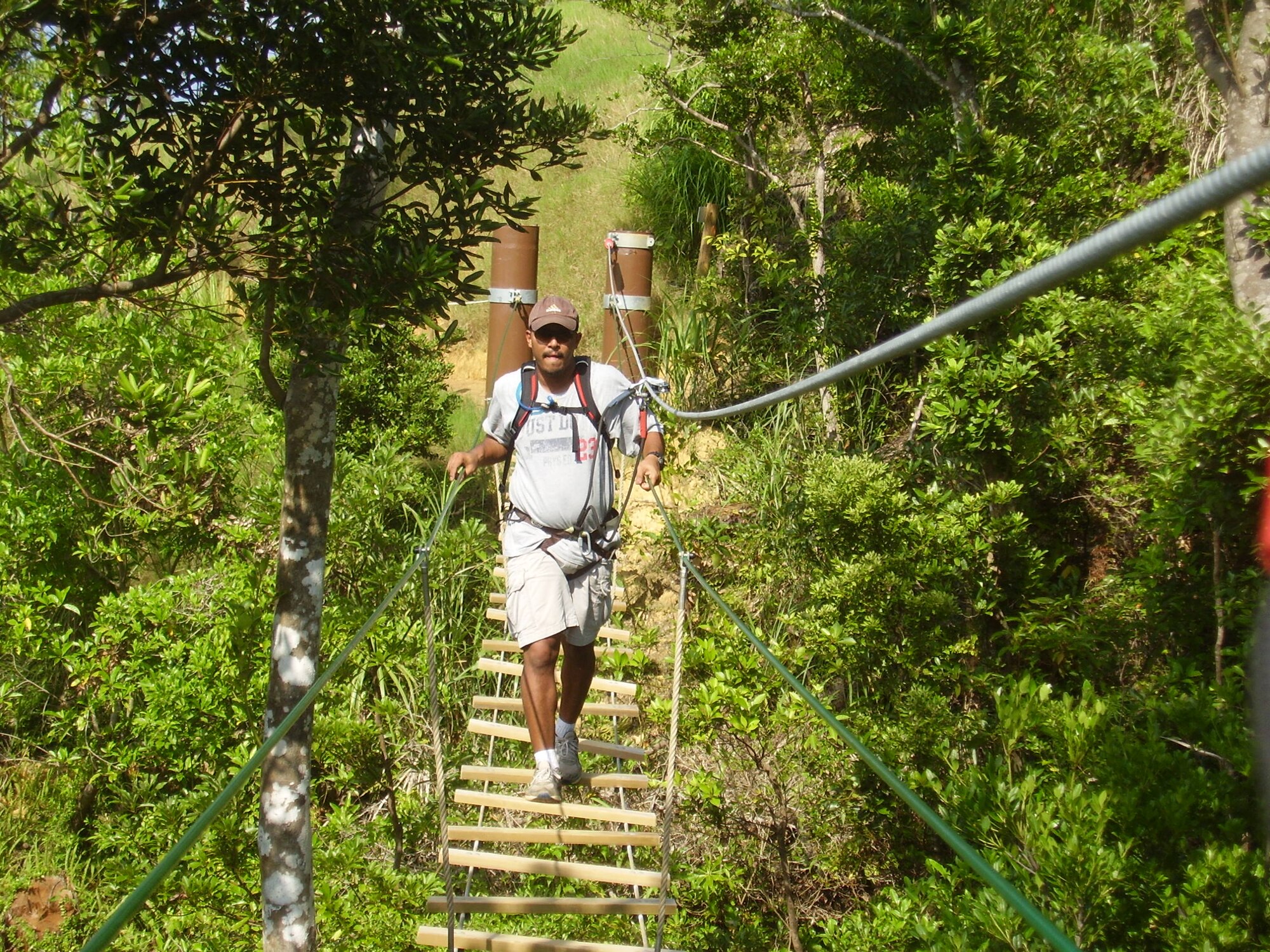 Daniel Aflleje, Schilling Community Center program director, crosses a swinging bridge at Forest Adventure Park in Onna, Japan. The trip to the Forest Adventure Park was made possible by the Kadena SIngle Airman Program. (Courtesy Photo)