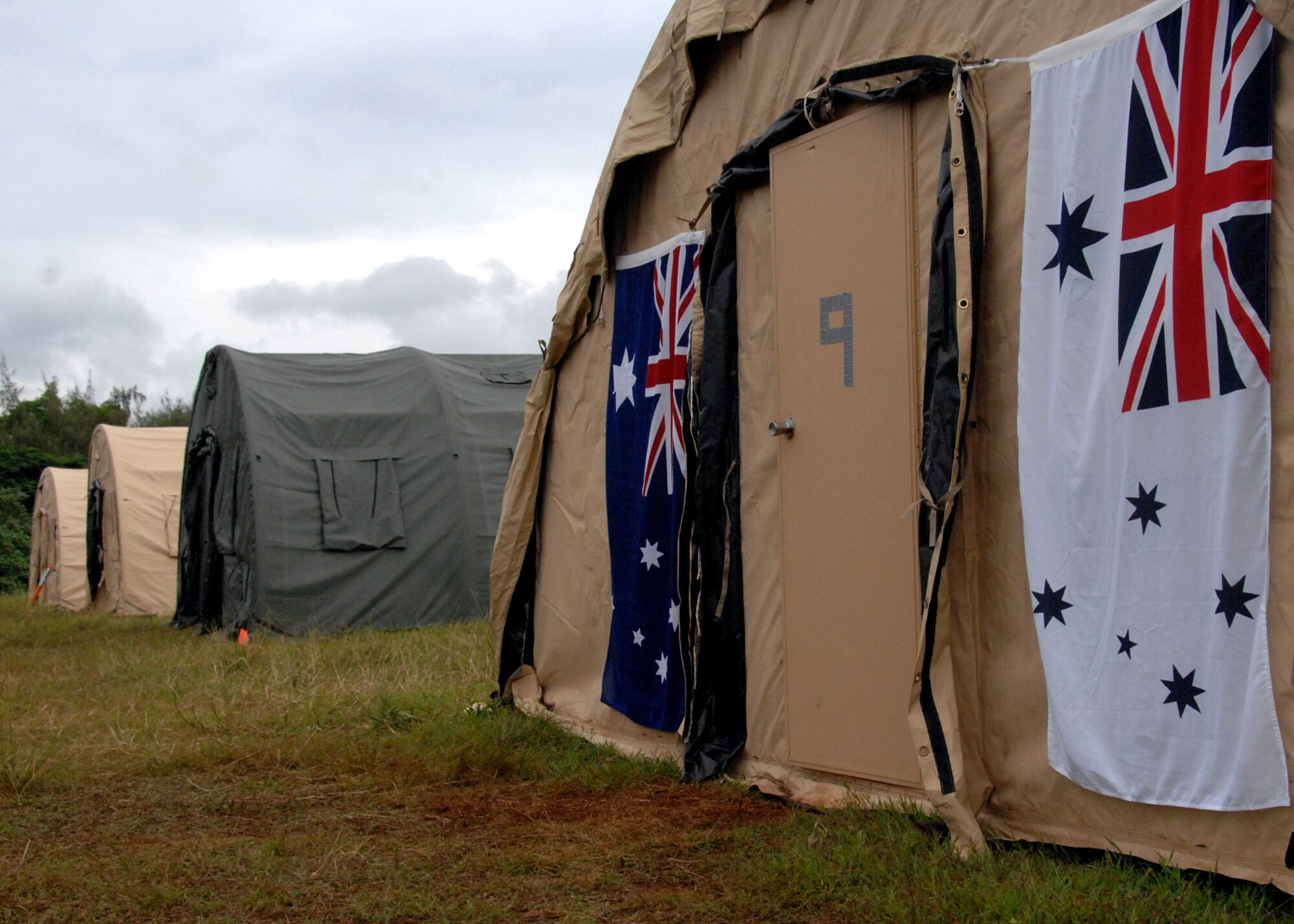 ANDERSEN AIR FORCE BASE, Guam - Members of the Royal Australian Air Force and Navy make their presence known Sept. 14-18 at Andersen South by displaying their colors outside of their tent. Twenty Royal Australian military members participated in the multinational, joint-service explosive ordnance disposal exercise with the U.S. Air Force, Navy and Army National Guard Guam. (U.S. Air Force photo by Airman 1st Class Nichelle Griffiths)