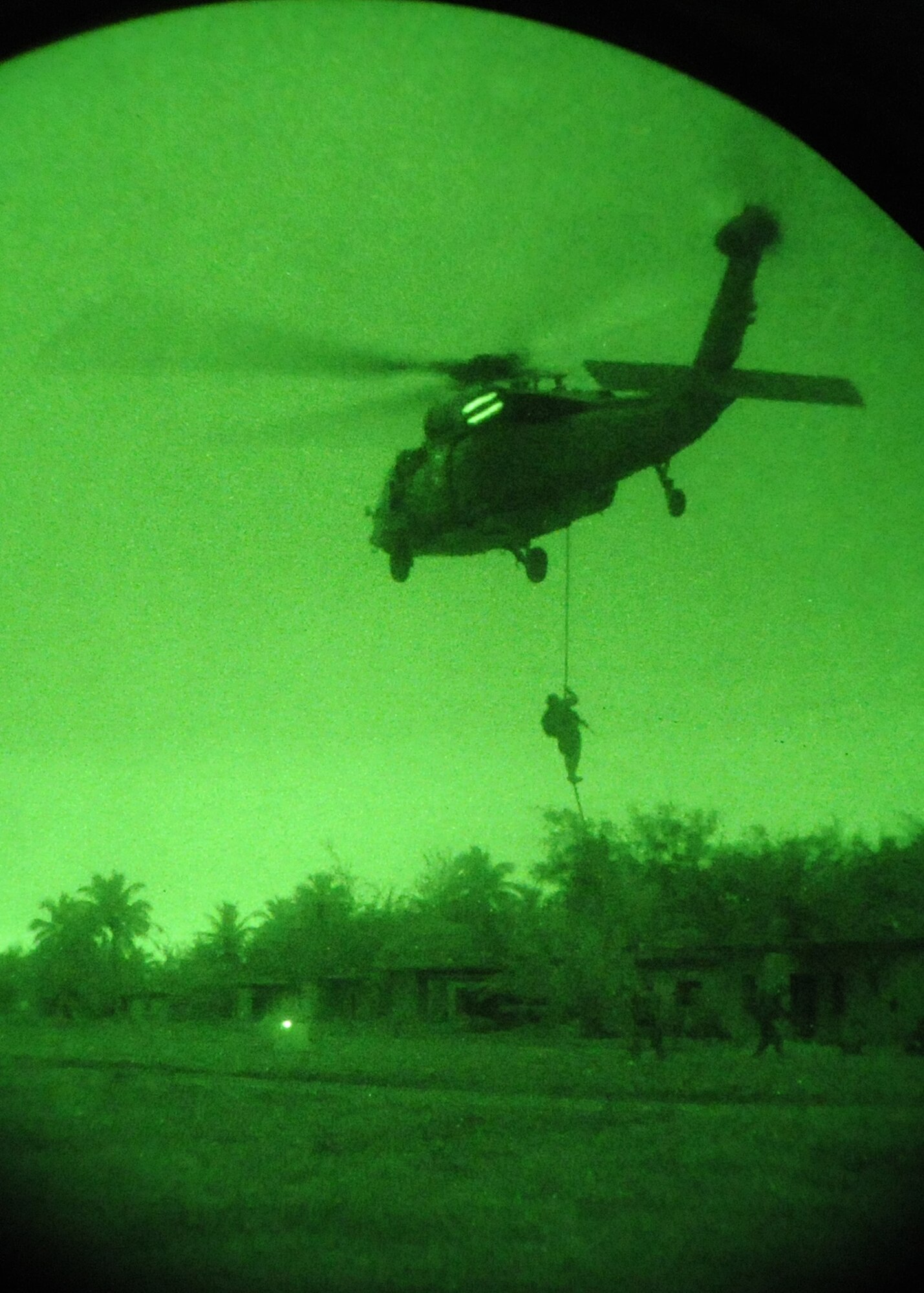 ANDERSEN AIR FORCE BASE, Guam- The Royal Australian Navy participates in a simulated fast rope scenario with the U.S. Navy, Helicopter Sea Combat Squadron, MH-60S Kinghthawk helicopter Sept. 17 at Andersen South. The scenario was one of many that took place during TRICRAB '08. Teams representing the U.S. Air Force, U.S. Navy, U.S. Army National Guard Guam, Royal Australian Air Force and Royal Australian Navy took part in this four day field exercise. (U.S. Air Force photo by Airman 1st Class Nichelle Griffiths)