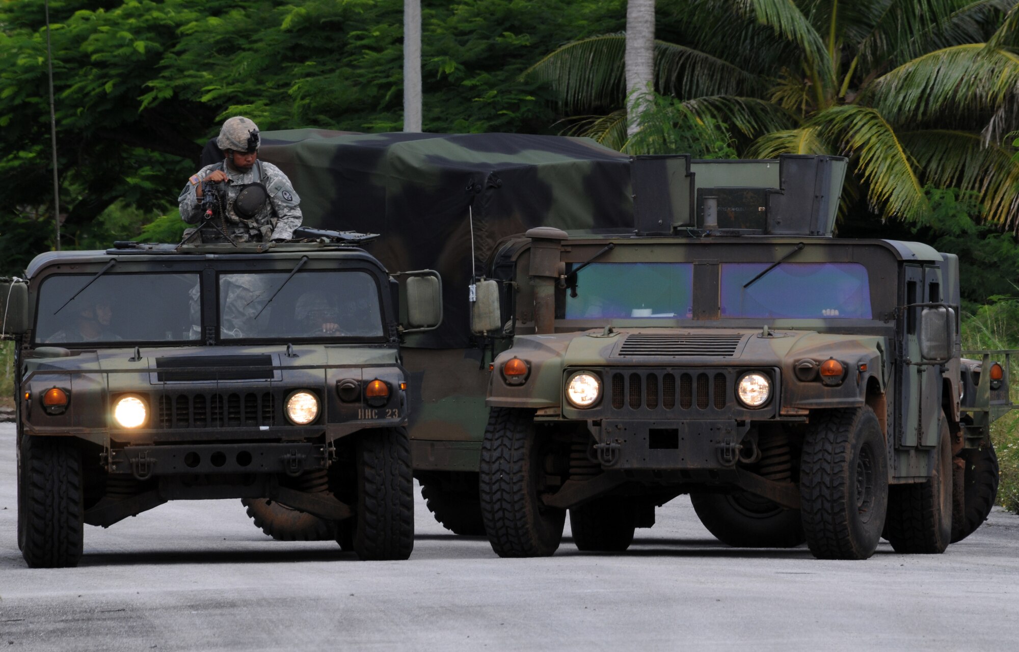 ANDERSEN AIR FORCE BASE, Guam – United States Army National Guard Guam members perform convoy security during the joint-service explosive ordnance disposal training here Sept. 17. The training focuses on individual battle drills, reaction to direct and indirect fire, communication skills, tactical convoy operations and improvised explosive devices. (U.S. Air Force photo by Airman 1st Class Nichelle Griffiths)