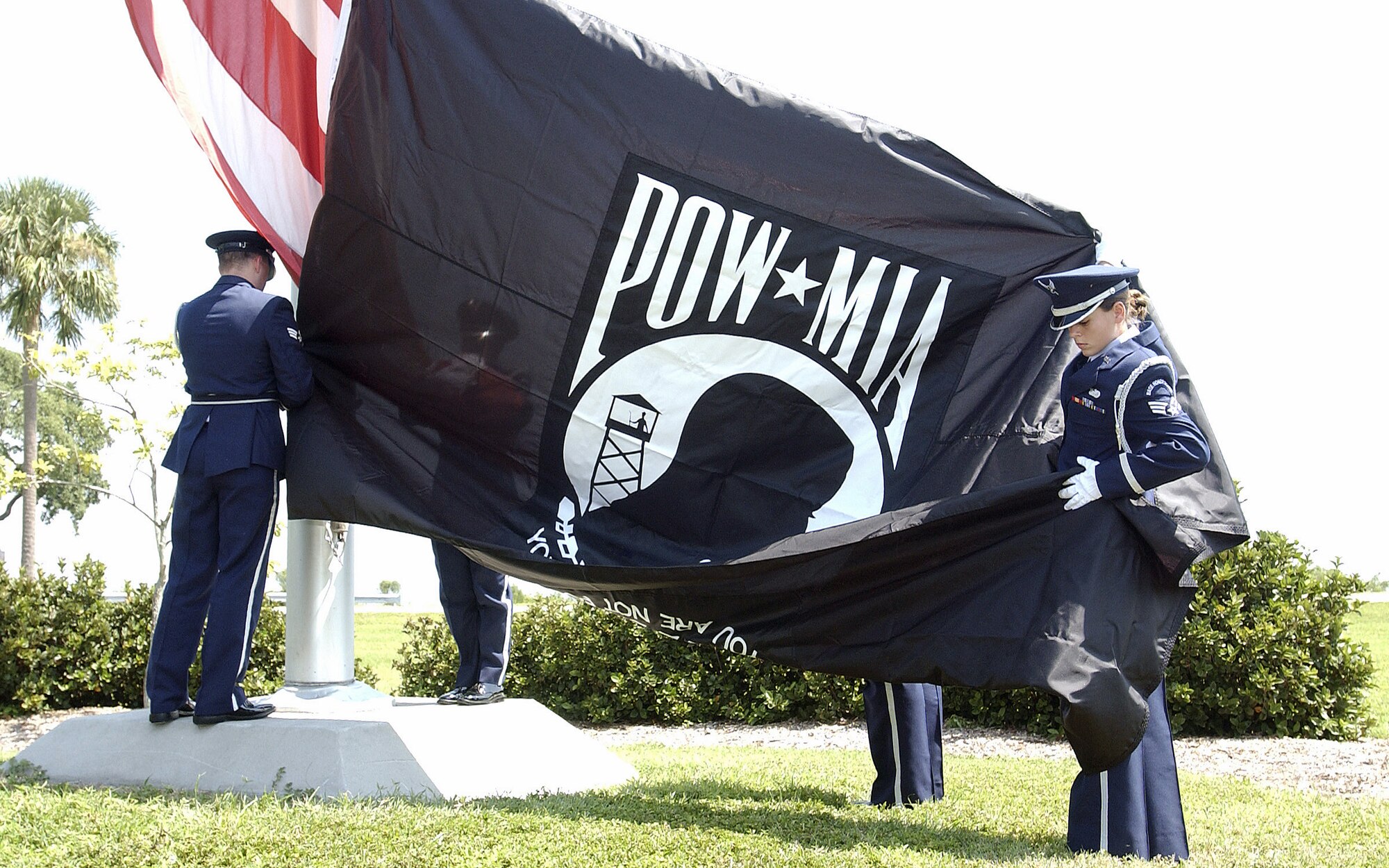 Members of the base honor guard at MacDill Air Force Base, Fla., prepare to raise the POW/MIA Flag at the National Recognition Day Ceremony.  Observances of National POW/MIA Recognition Day are held across the country on military installations, ships at sea, state capitols, schools and veterans' facilities. This observance is one of six days throughout the year that Congress has mandated the flying of the National League of Families' POW/MIA flag. The others are Armed Forces Day, Memorial Day, Flag Day, Independence Day and Veterans Day.   (U.S. Air Force photo)