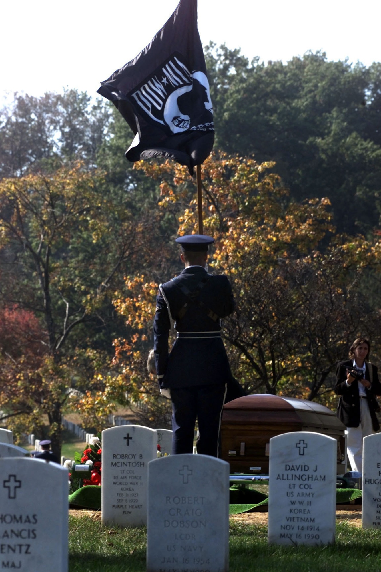 An Airman holds the POW/MIA flag during a ceremony at Arlington National Cemetery in Arlington, Va.  (U.S. Air Force photo)