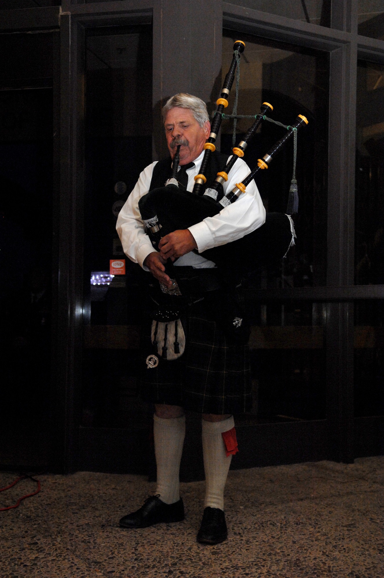 Mr. William Meacher, of Empyre Pipes and Drums, plays ?Amazing Grace? on his bagpipes during the candle-lighting ceremony at the seventh annual 9/11 Memorial Ceremony at the New Mexico Museum of Space History, September 11. The event was put together by the Fire Department of Holloman Air Force Base, N.M., and the Otero County Firefighters Assocation. (U.S. Air Force photo/Airman Sondra M. Escutia)