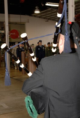 MCCONNELL AIR FORCE BASE, Kan.-- Aaron Montgomery, Wichita Caledonian Pipes and Drums bagpiper, plays “Amazing Grace” at the McConnell Patriot Day Ceremony held at the base fire department, Sept. 11. (Photo by Staff Sgt. Jamie Train)