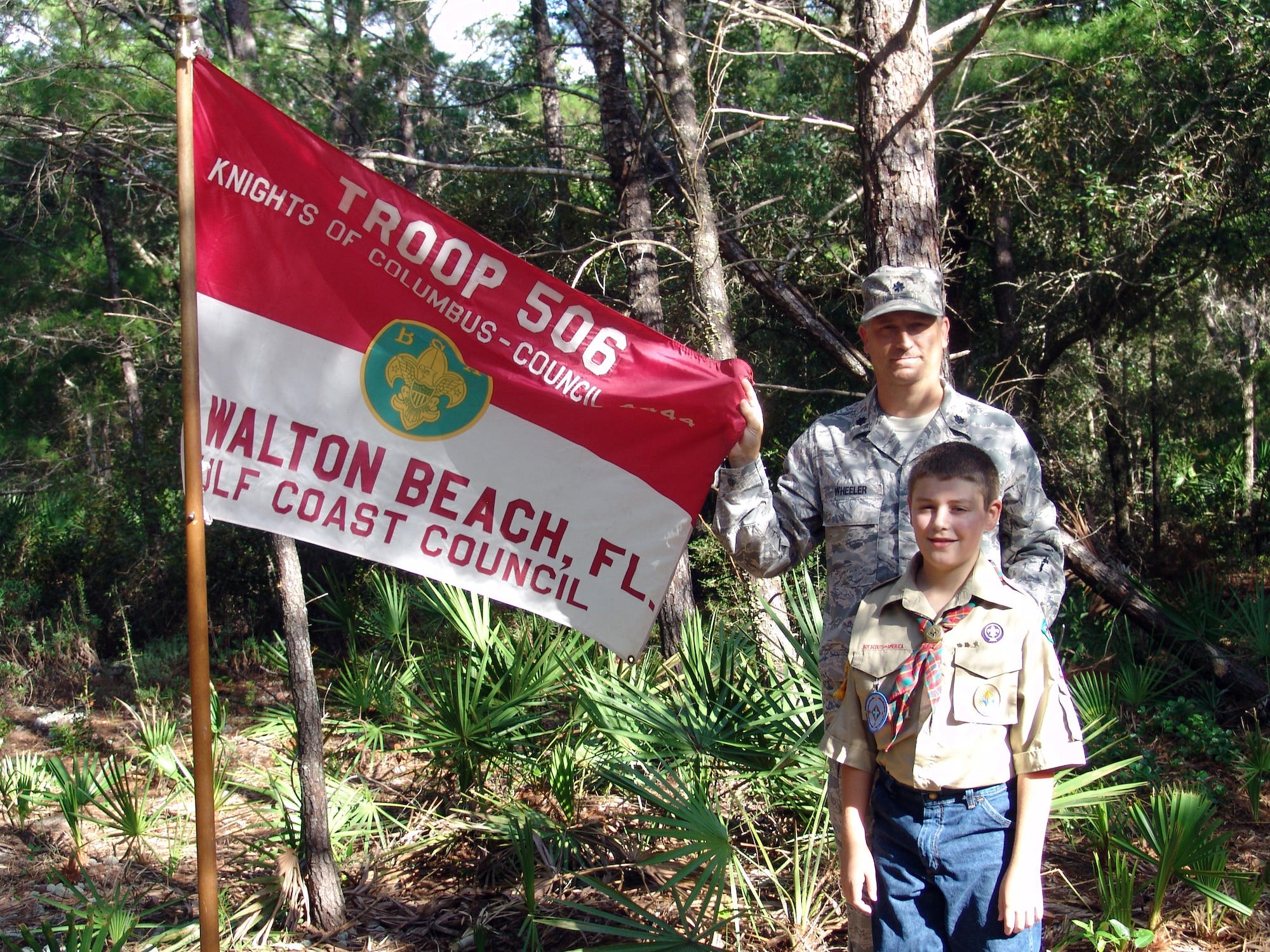 EGLIN AIR FORCE BASE, Fla. -- Lt. Col. Christopher Wheeler, 96th Mission Support Group commander, and a member Boys Scouts of America Troop 506 were on hand to celebrate the Woodland Trails Youth Camp reopening Sept. 13. The camp originally opened in 1967 and boasted overnight camping trips and a nature trail. (U.S. Air Force photo/ Marie Vanover)