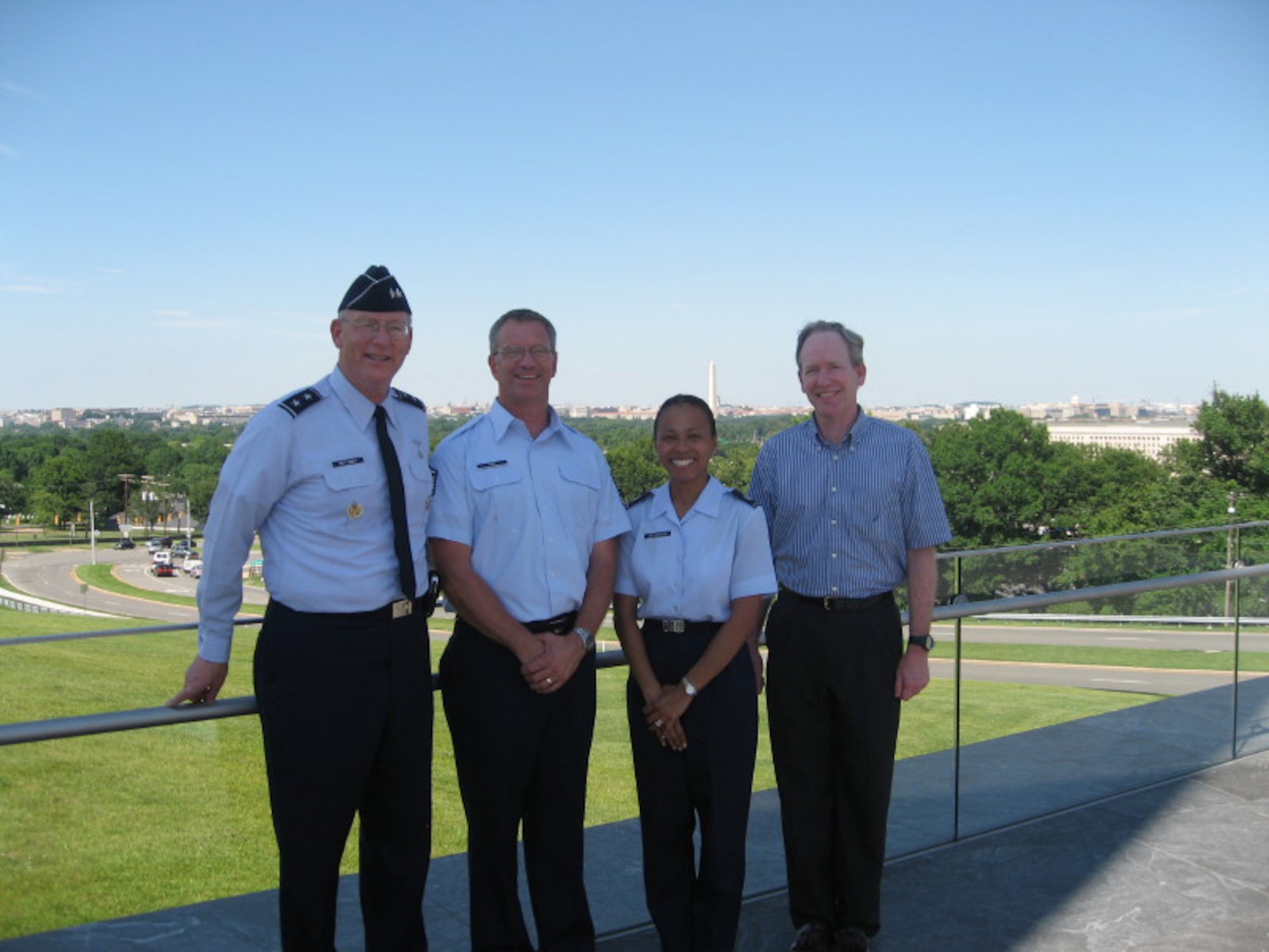 Maj. Gen. Paul Dettmer, Headquarters Air Force deputy of intelligence, poses for a photo with Air Force Intelligence, Surveillance and Reconnaissance annual award winners Master Sgt. Charles King, Lt. Col. Lisa Stevenson and Mike Lewis recently at the Air Force Memorial in Arlington, Va. The three AFSOC intelligence professionals were presented their awards during a ceremony at Langley Air Force Base. (courtesy photo)