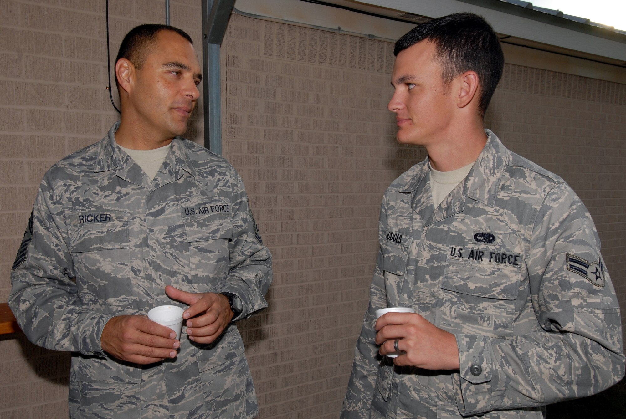 Chief Master Sgt. Frederick Ricker, 17th Training Wing command chief master sergeant, mentors Airman First Class Andrew Hodges, 17th Communications Squadron, a member of the current First Term Airman Center class at Goodfellow Air Force Base, over coffee during the FTAC class's visit Thursday to the Veterans of Foreign Wars Post 1815 in San Angelo. (U.S. Air Force photo by Senior Airman Kasabyan Musal)