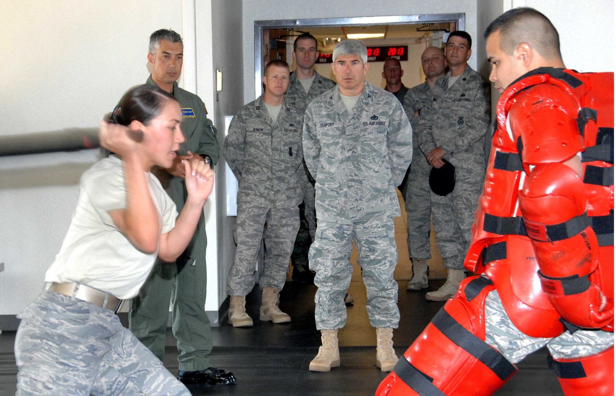 Col. Nicholas Desport, Deputy Director, Installations and Mission Support, Headquarters Air Mobility Command, Scott Air Force Base, Ill., watches members of the 60th Security Forces Squadron Phoenix Ravens performing a demonstration Sept. 16. Travis was inspected by the team to compete for a $100,000 prize to use toward improving the quality of life on base. (U.S. Air Force photo/Nan Wylie)

