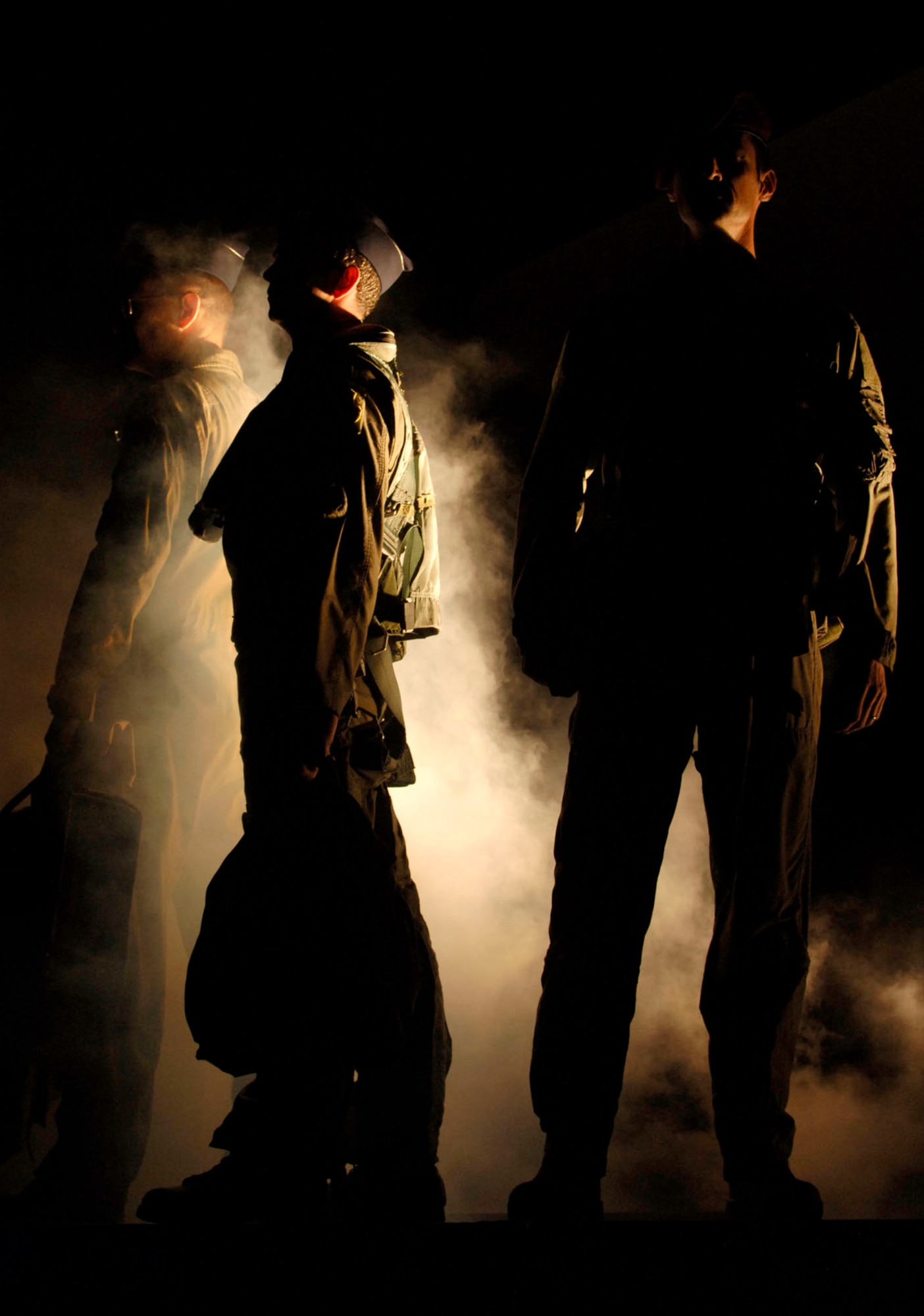 LANGLEY AIR FORCE BASE, Va.-- Langley Airmen participate in a ceremony honoring fallen servicemembers during the Air Combat Command Tattoo ceremony Sept. 11. The Tattoo was a mixture of music, lights and fireworks honoring the nation's military, past and present. (U.S. Air Force photo/Airman Rebecca Montez)