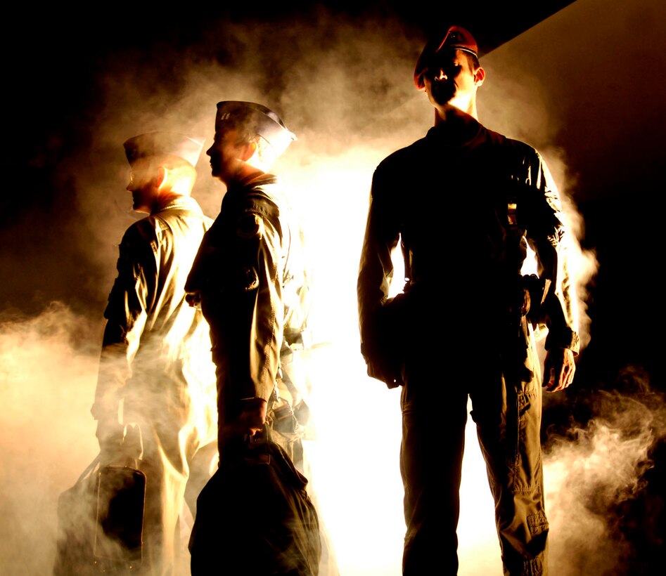 LANGLEY AIR FORCE BASE, Va.-- Langley Airmen participate in a ceremony honoring fallen servicemembers during the Air Combat Command Tattoo ceremony Sept. 11. The Tattoo was a mixture of music, lights and fireworks honoring the nation's military, past and present. (U.S. Air Force photo/Airman Rebecca Montez)