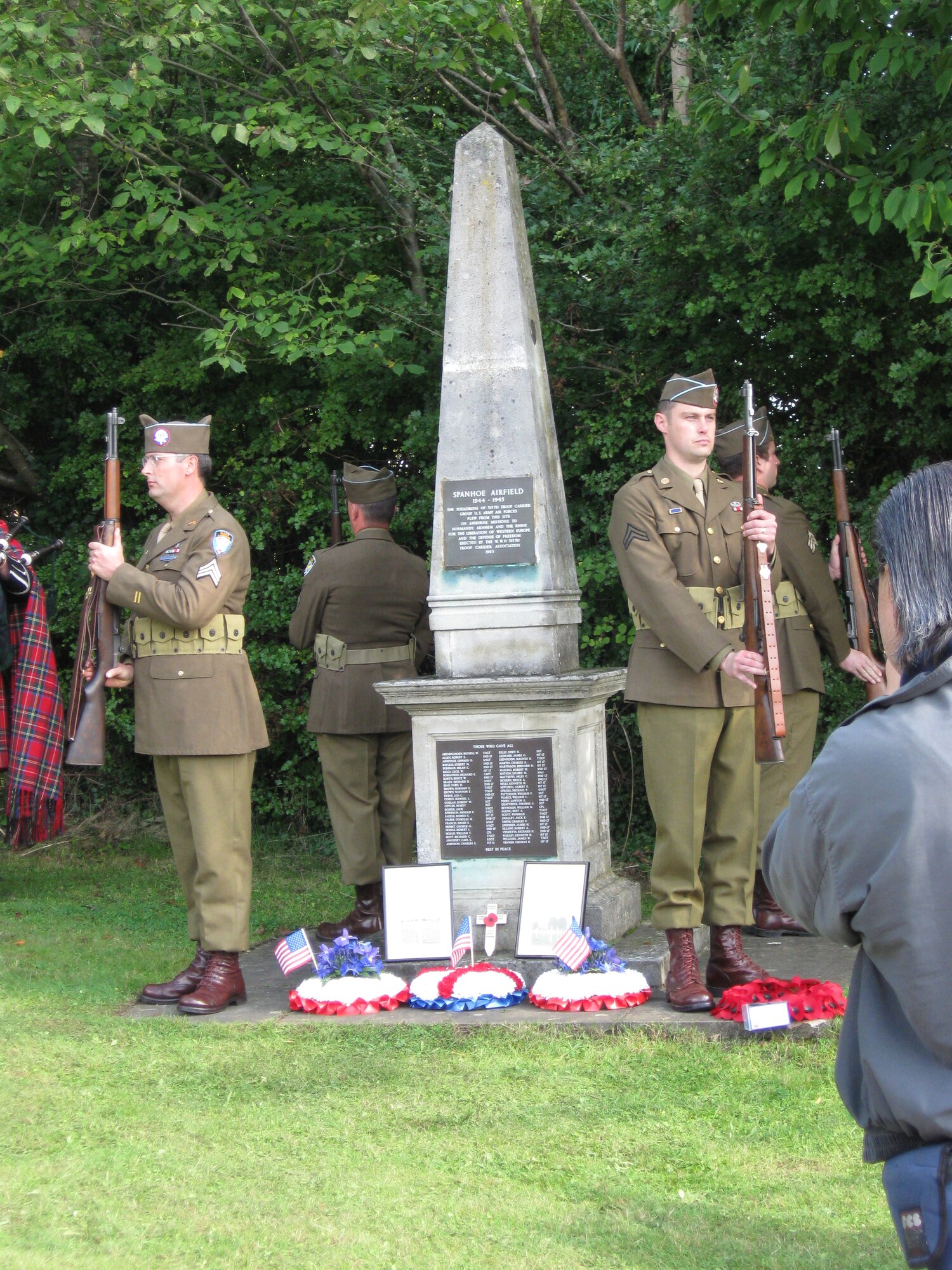 An Honor Guard in period dress stands guard at a memorial to the 315th TCG that stands at RAF Spanhoe, England. (U.S. Air Force courtesy photo)