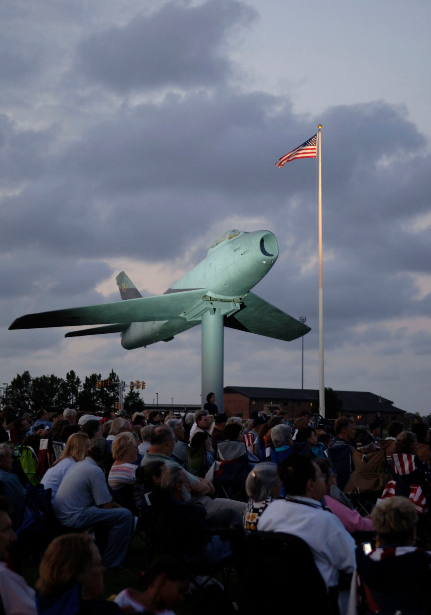 LANGLEY AIR FORCE BASE, Va.-- The crowd watches the Air Combat Command Heritage of America Band during the Air Combat Command Tattoo Ceremony Sept. 11. The Tattoo was a mixture of music, lights and fireworks honoring the nation's military, past and present. (U.S. Air Force photo/Airman Rebecca Montez)