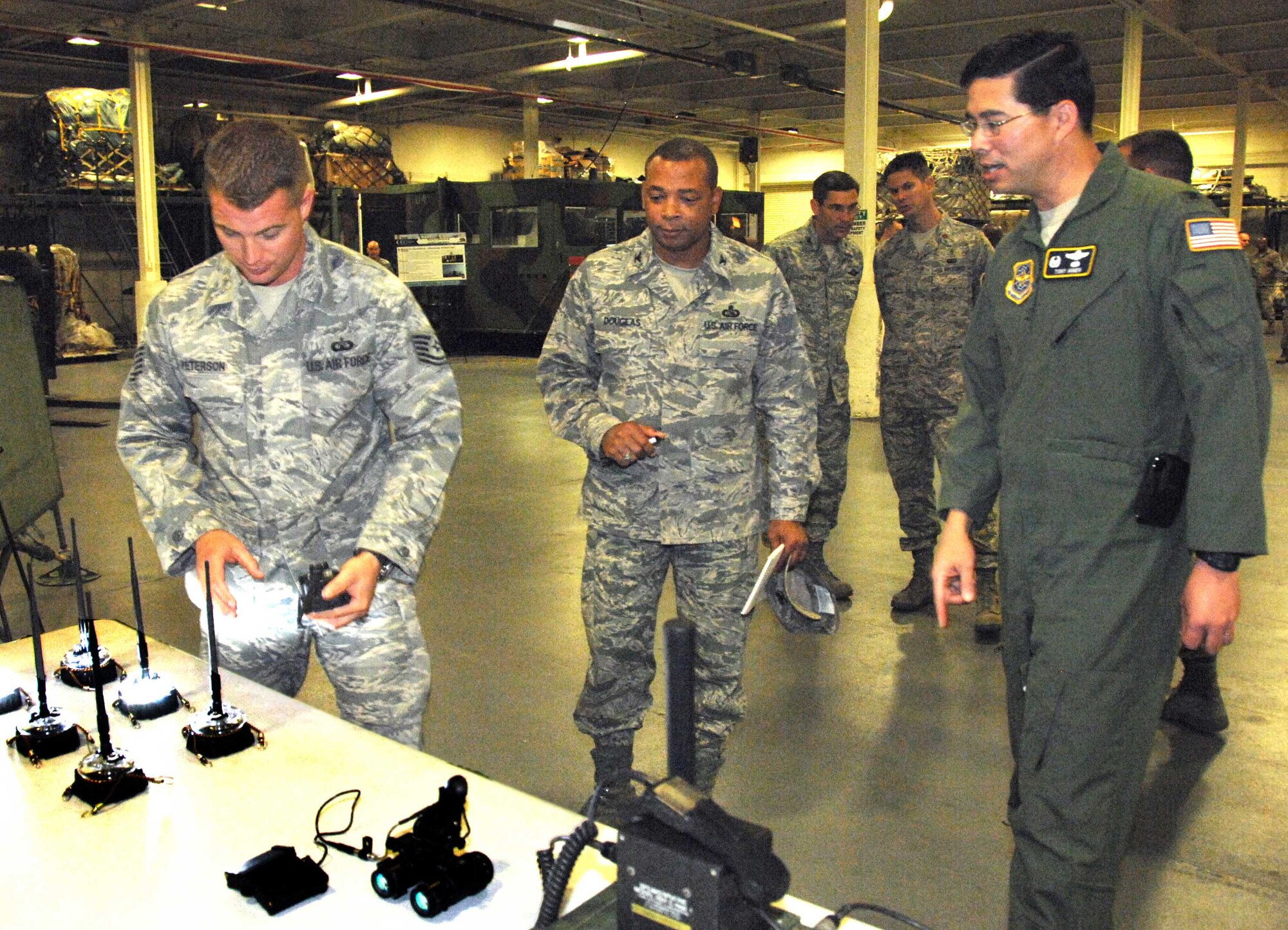 Col. Tony Hinen, 615th Contingency Response Wing commander, briefs Col. John Douglas, member of the Commander-in-Chief Installation Excellence team, Sept. 16. Colonel Hinen will retire after more than 27 years of commissioned service. (U.S. Air Force photo/Nan Wylie)