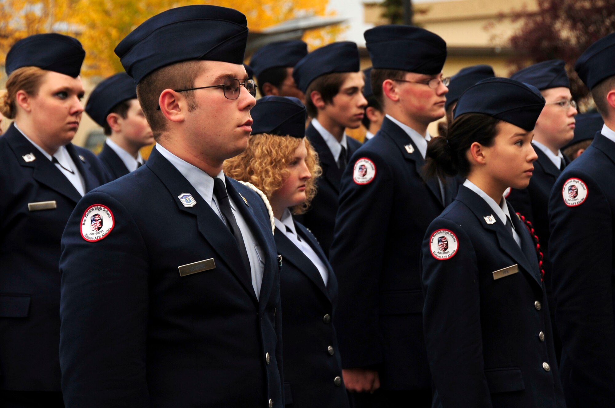 Cadets stand in formation during the Sept. 11 reveille ceremony infront of Amber Hall. Ben Eielson Junior Reserve Officer Training Corps cadets perform an annual reveille ceremony, this one highlighting the anniversary of the Sept. 11 attack on the U.S.  (U.S. Air Force photo/Staff Sgt. Tia Schroeder)